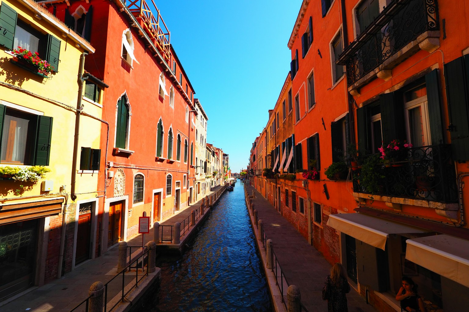 A scenic canal view surrounded by colorful buildings