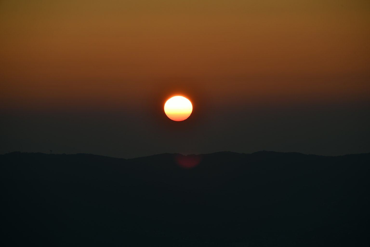 Beautiful sunset over the mountains with a clear sky