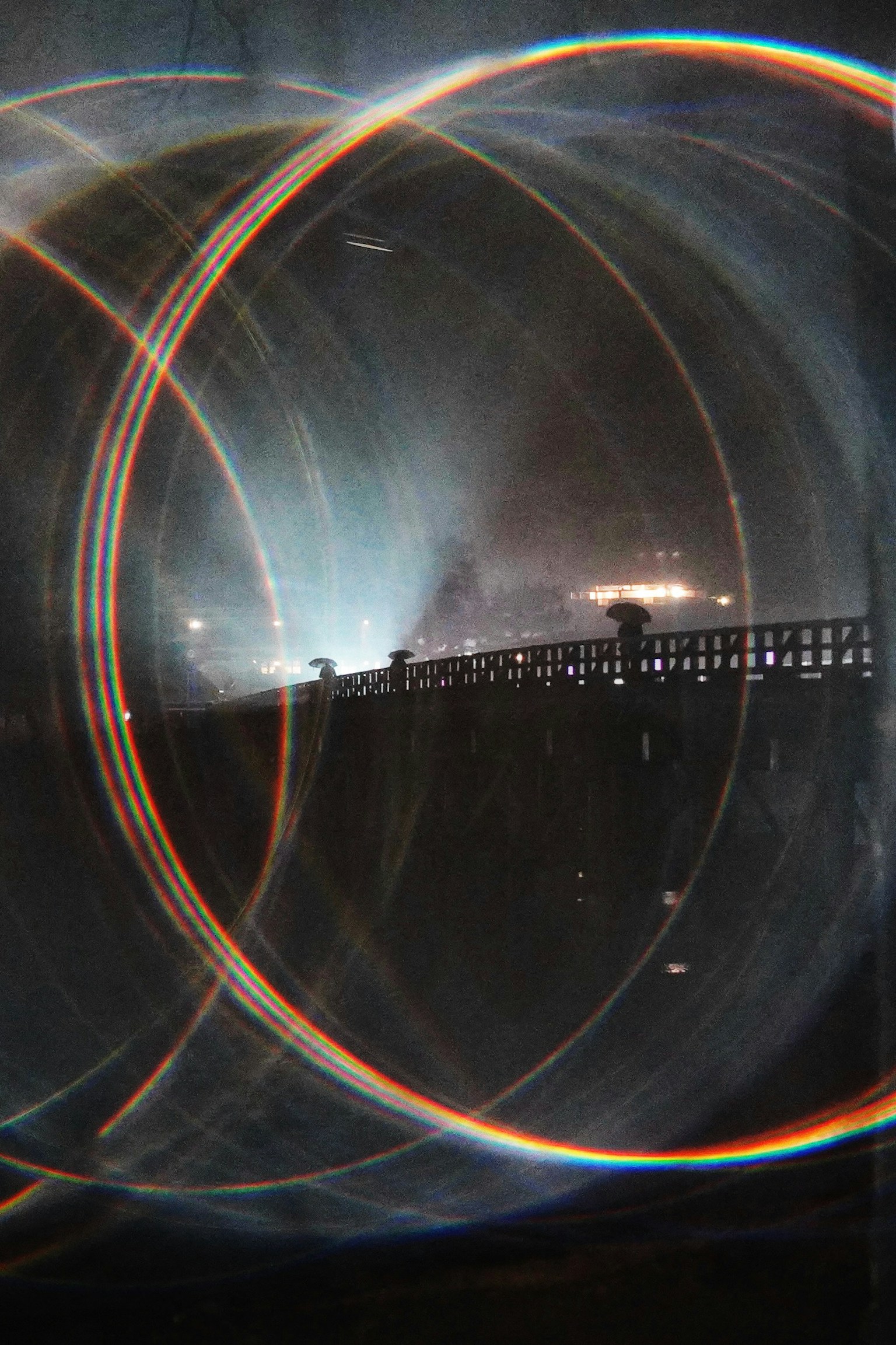 Night scene featuring circular light patterns and a blurred background