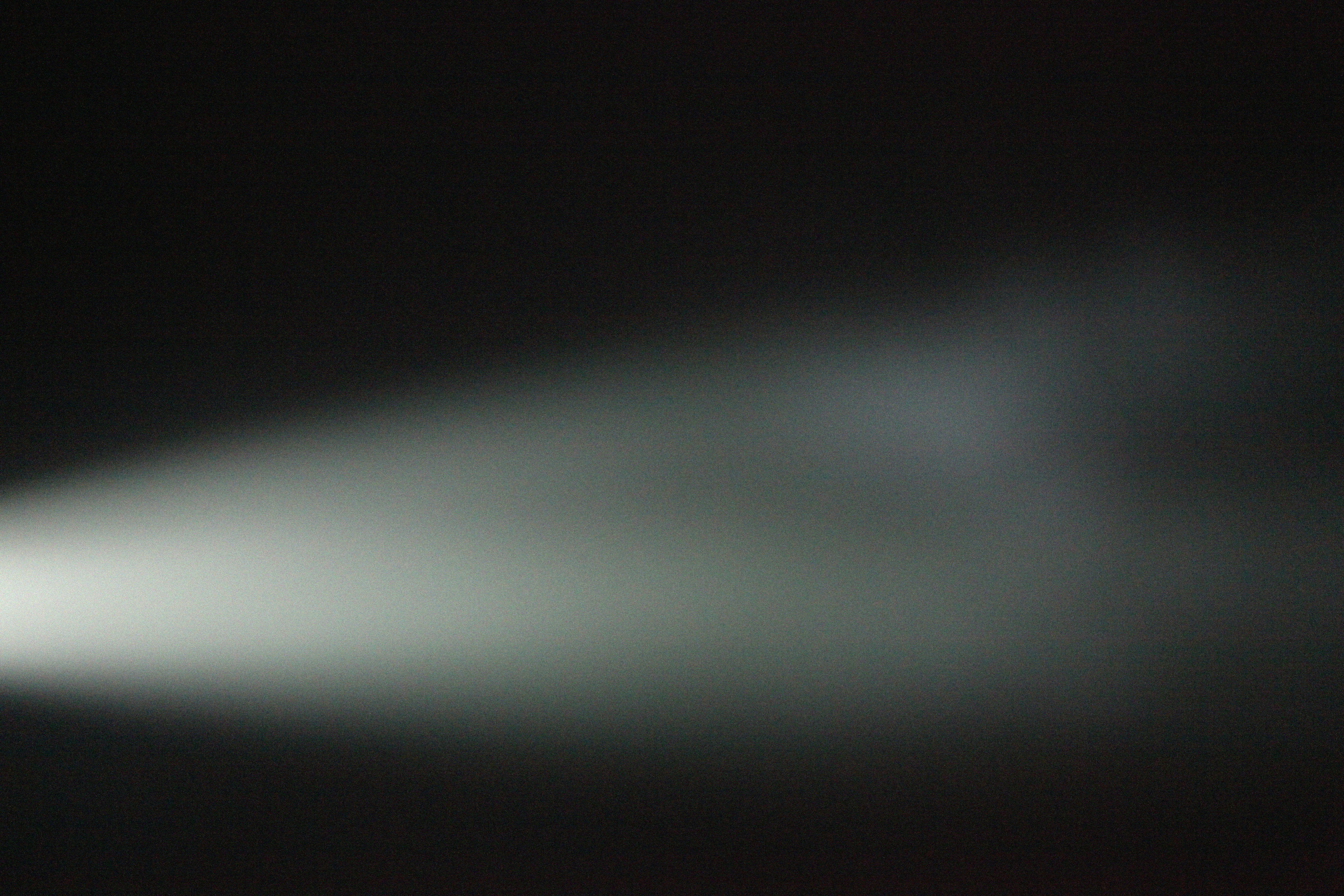 abstract blurred light streaks on a dark background