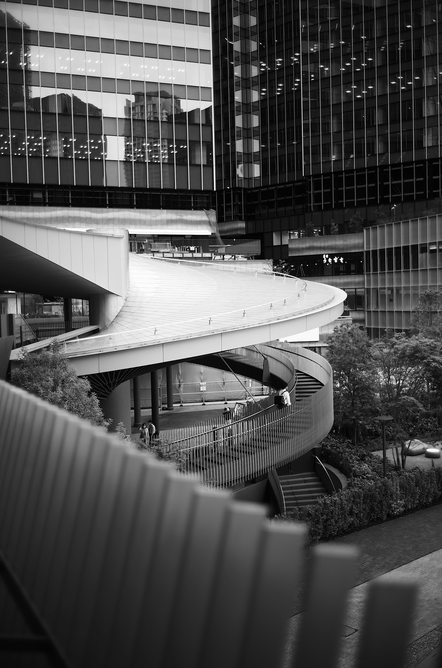 Modern architecture featuring curved staircases in an urban landscape