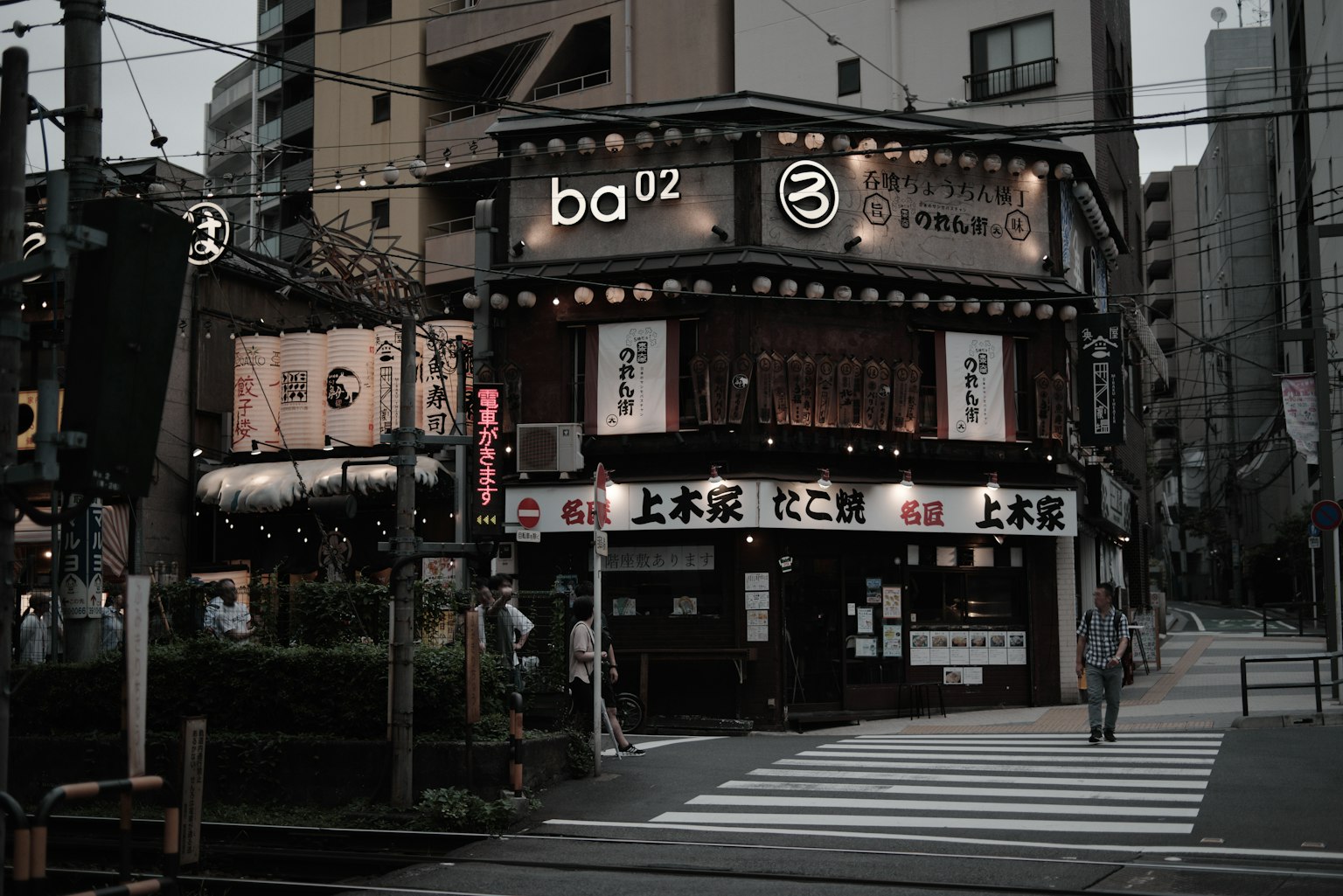 Exterior of a restaurant in Tokyo with prominent neon signs