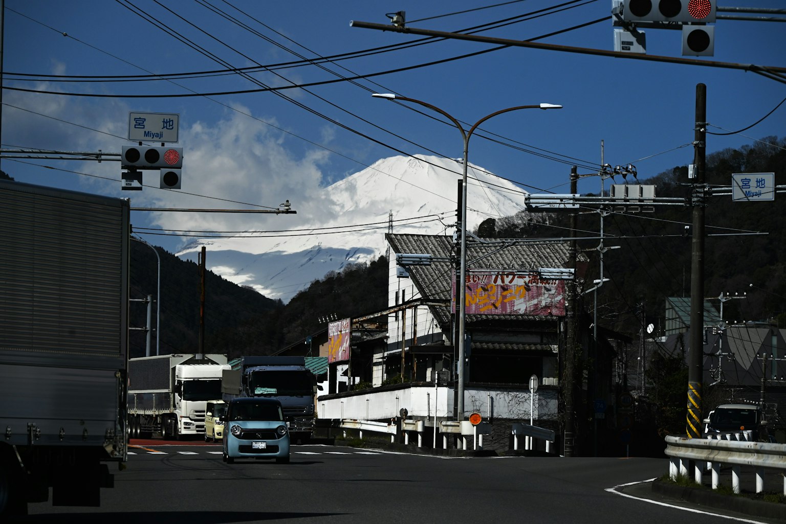 Road scene with trucks and Mount Fuji in the background