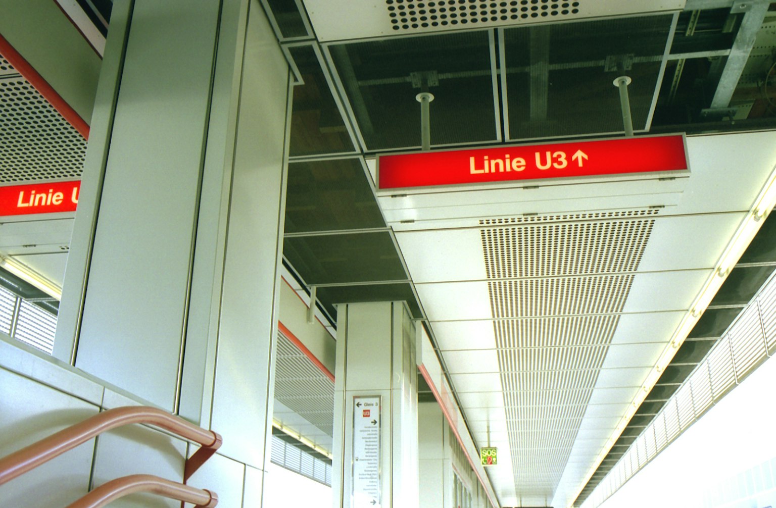 Ceiling view of a subway station sign for Line U3