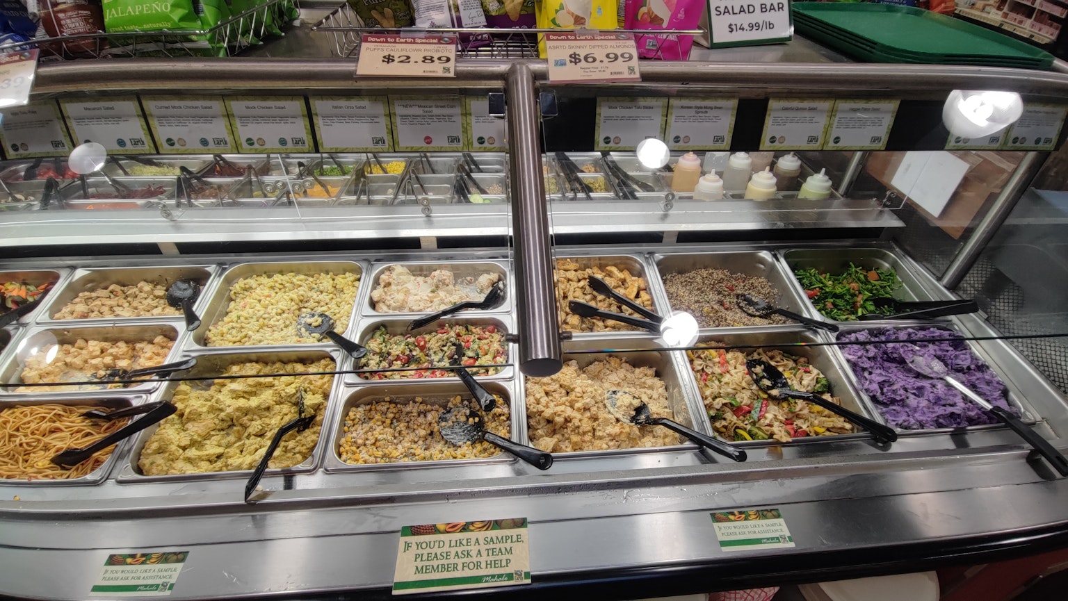 Buffet-style counter featuring a variety of deli dishes
