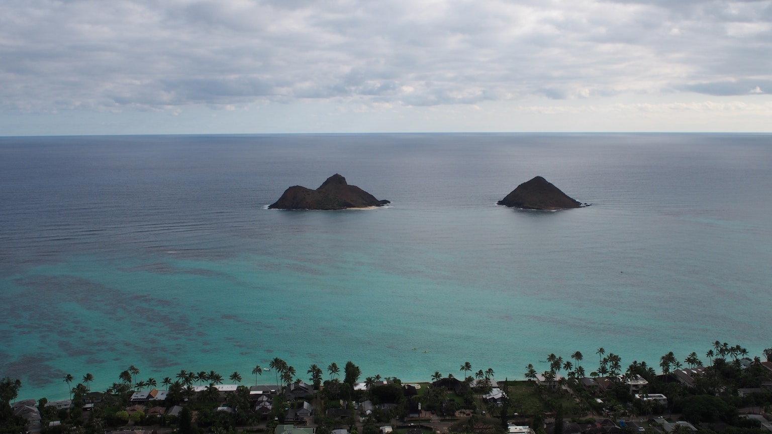 Stunning view of Lanikai Beach with two small islands in the turquoise sea
