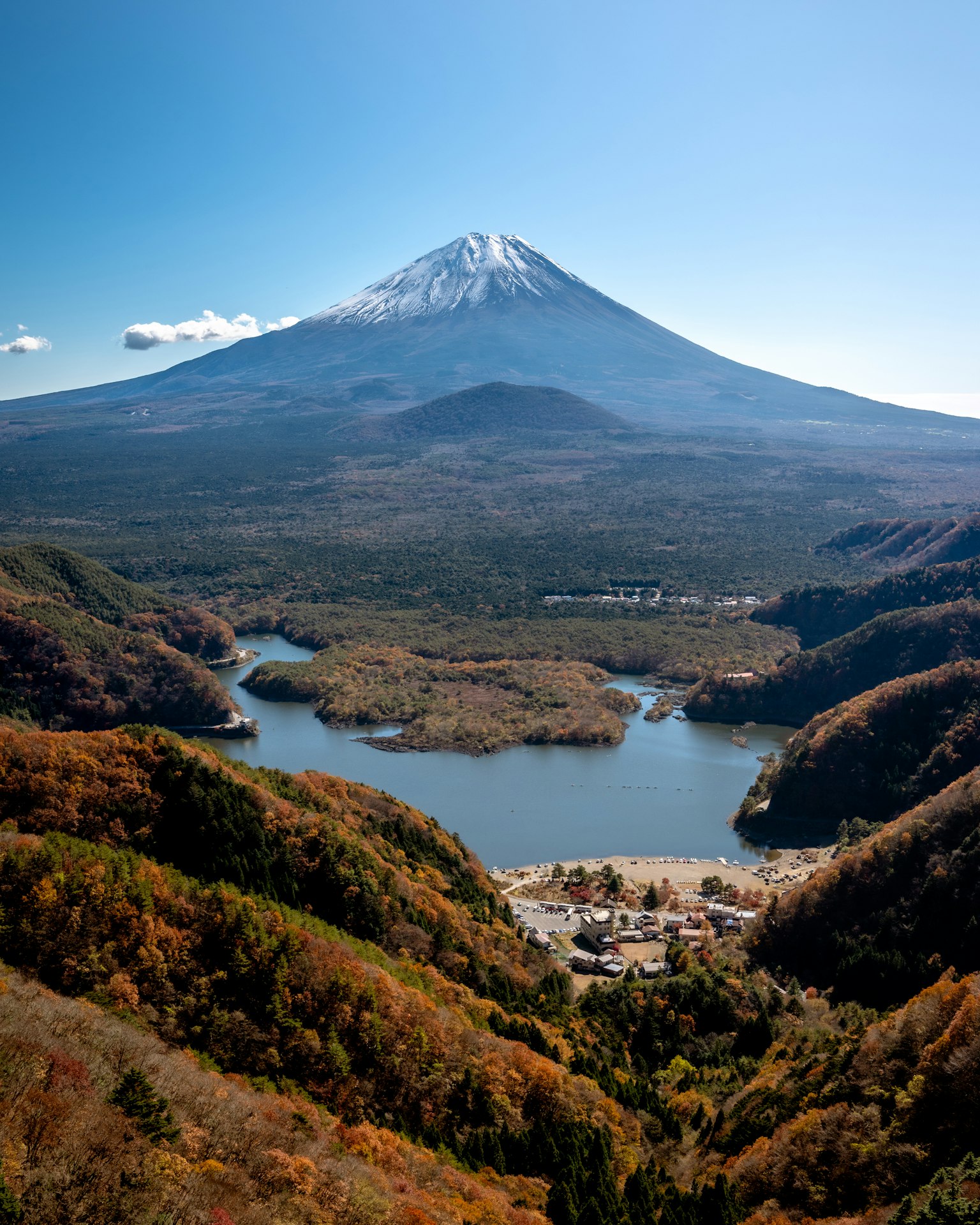 Stunning view of Mount Fuji surrounded by mountains and a lake
