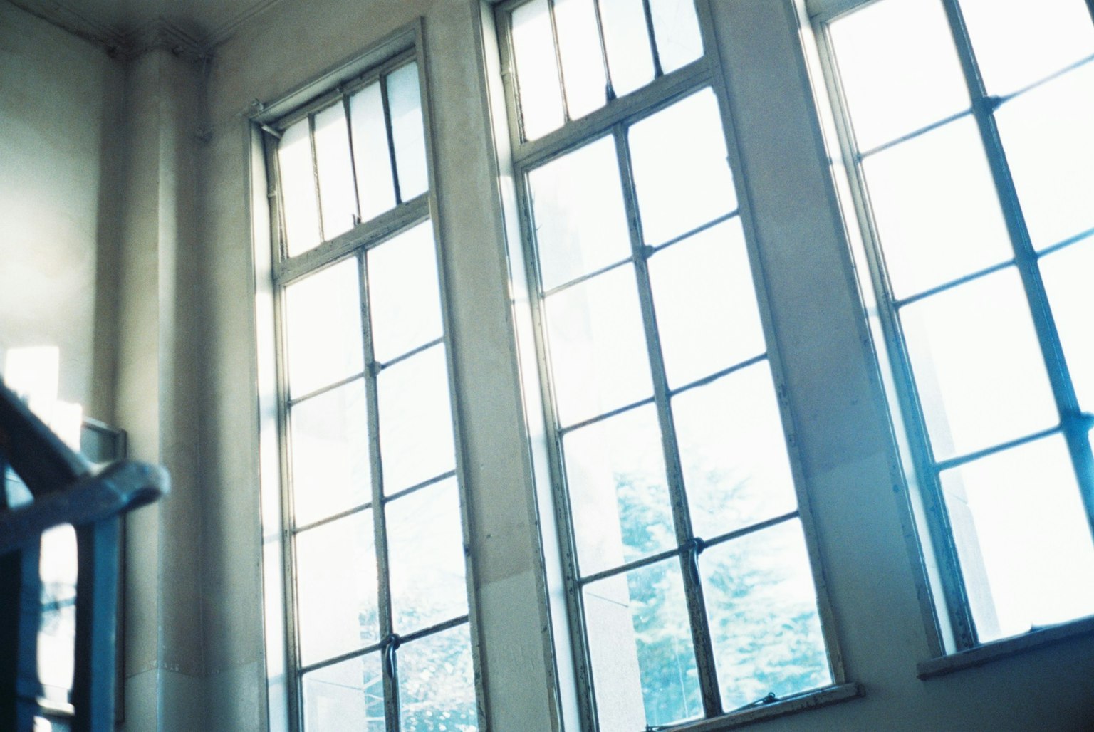 Interior of a room with large windows letting in natural light