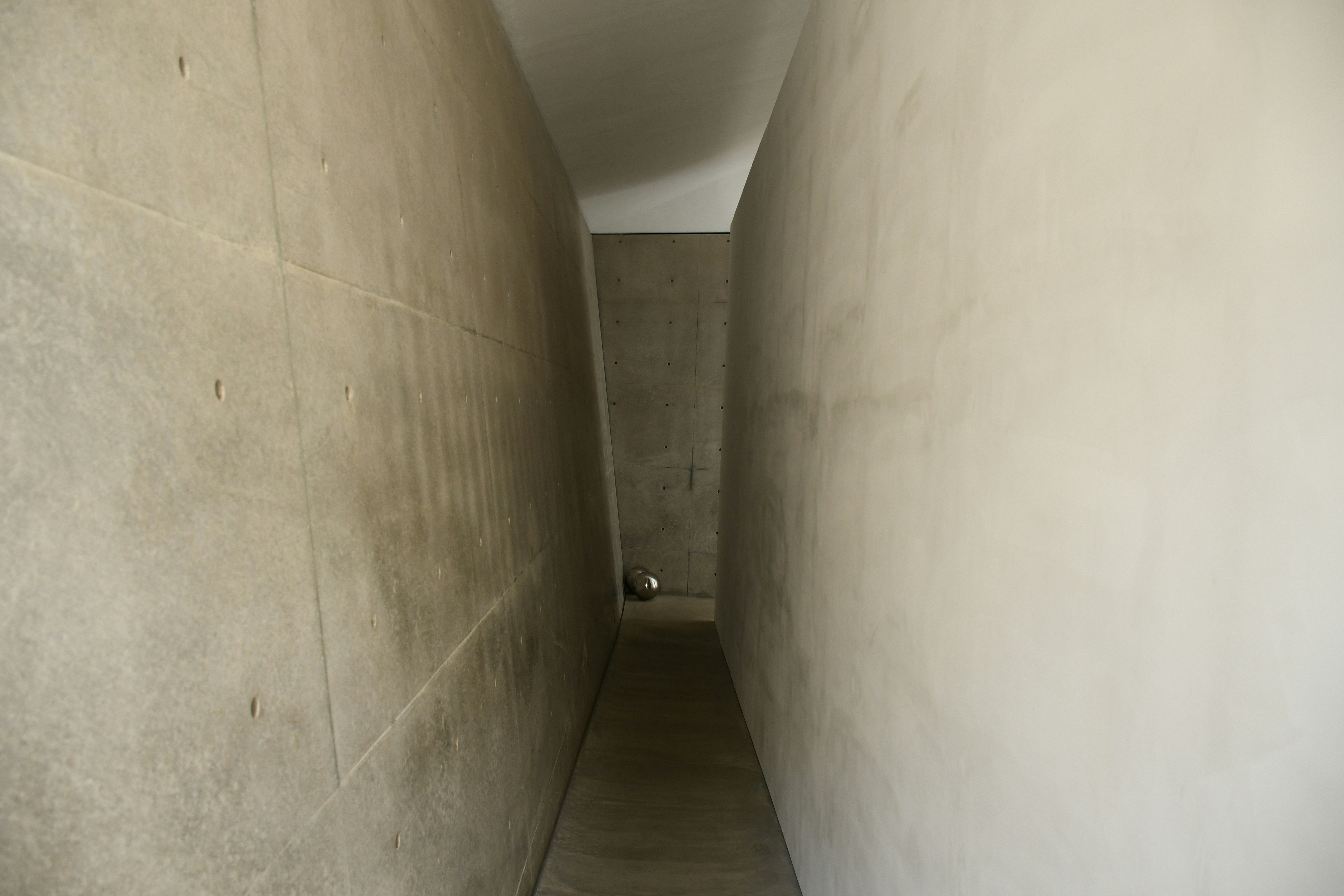 depth of a narrow concrete corridor