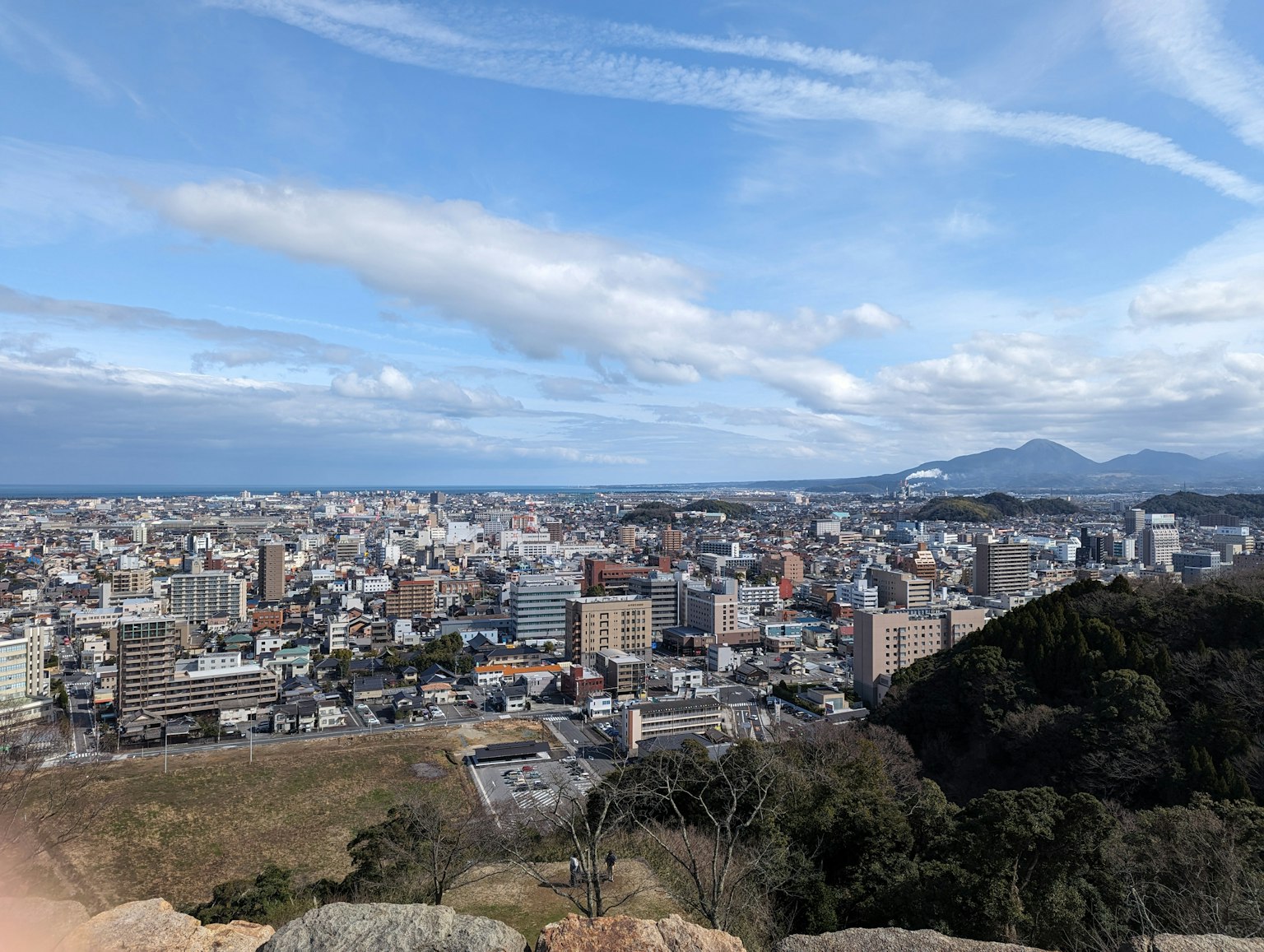 Cityscape view featuring buildings and mountains