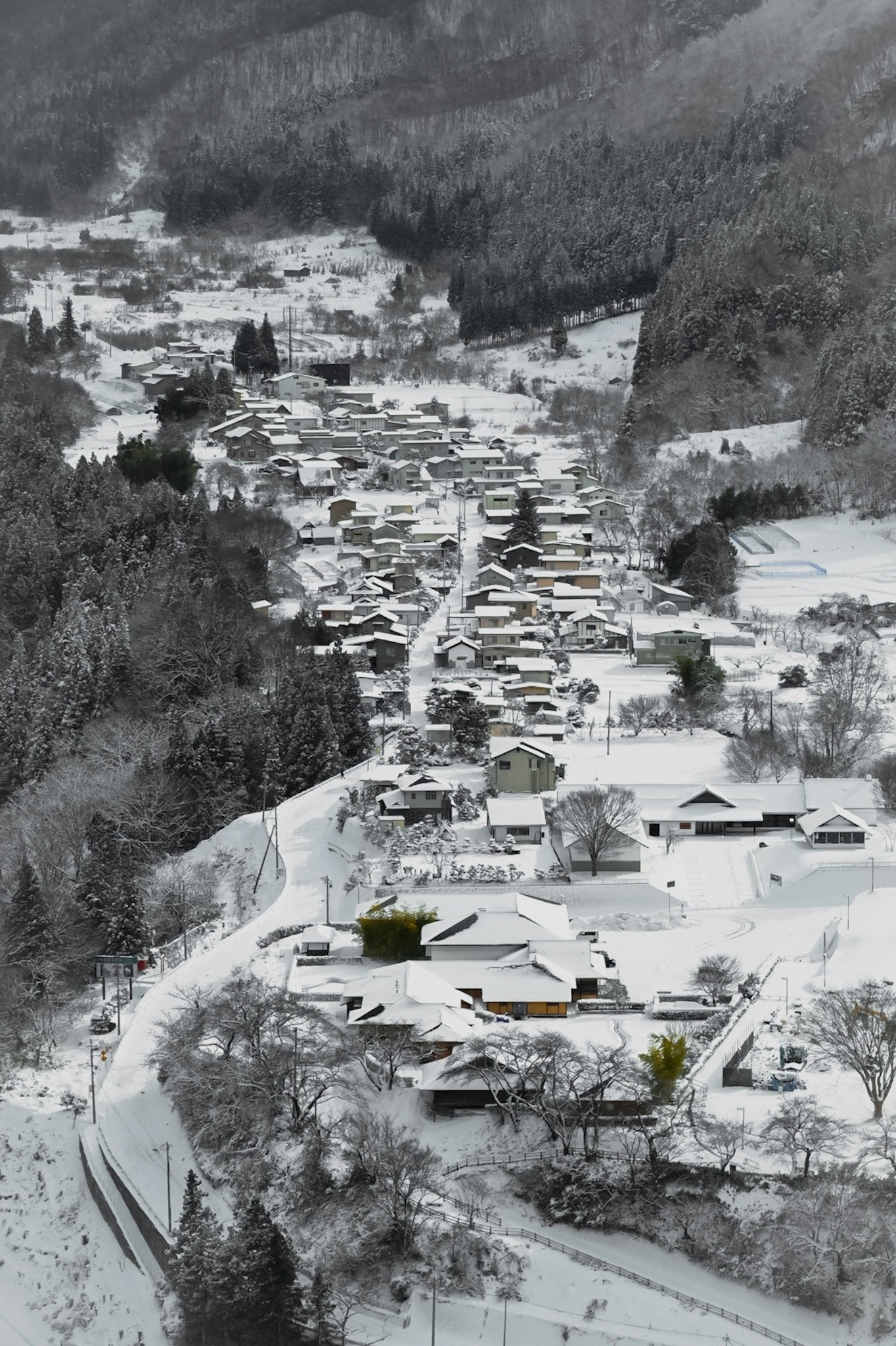 snow-covered mountain village with clustered houses