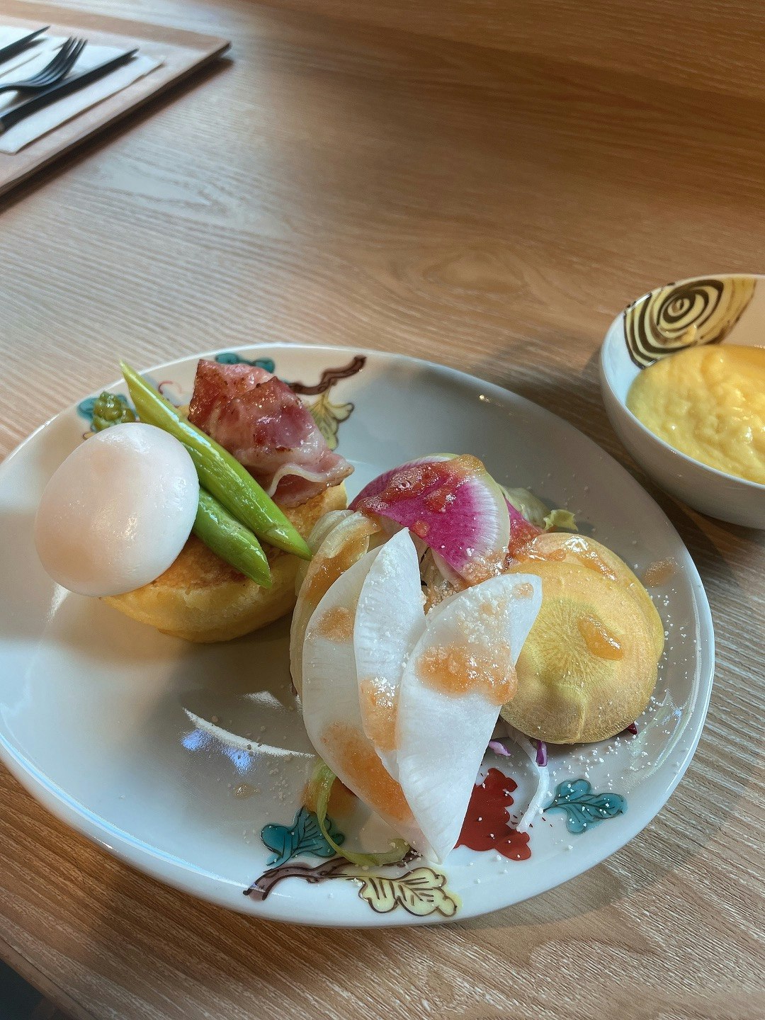 appetizer plate with soup on a wooden table