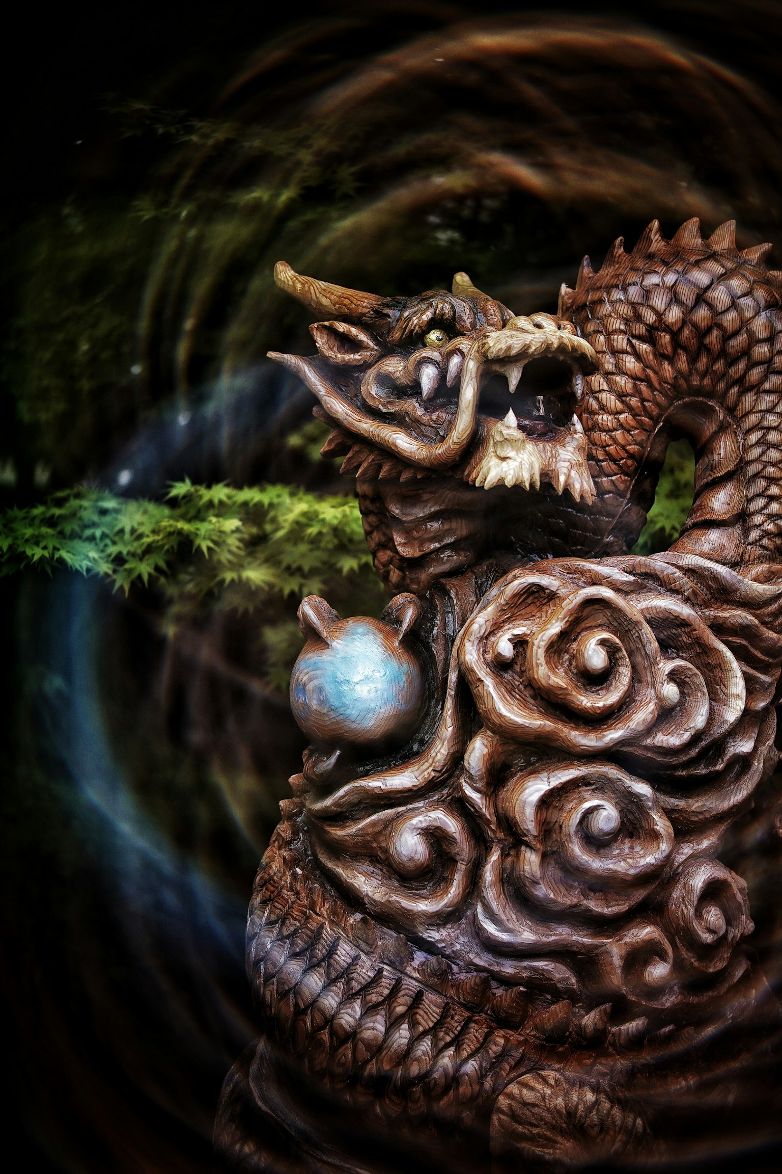Decorative dragon sculpture against a mystical background