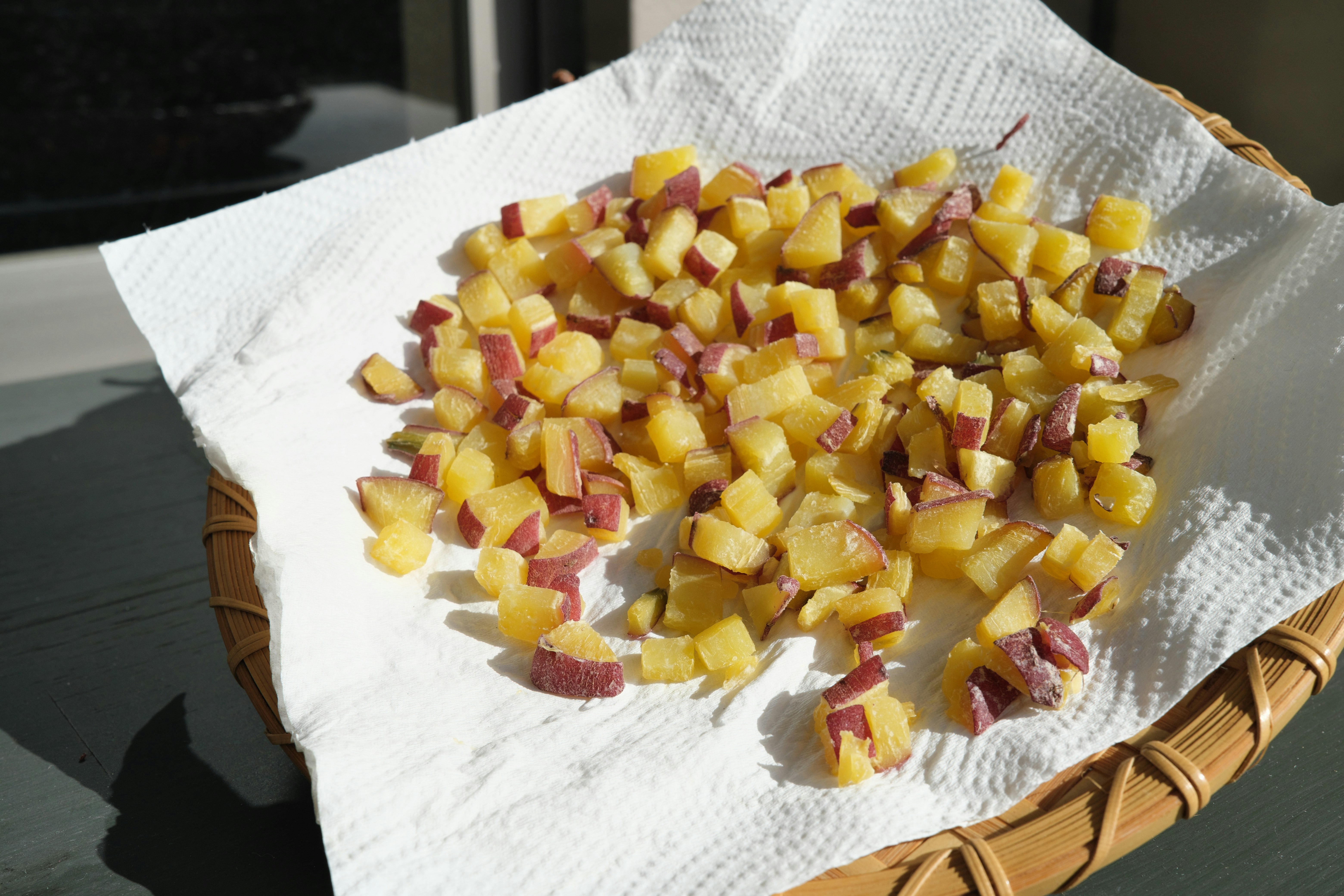 diced ham and yellow ingredients on a white paper
