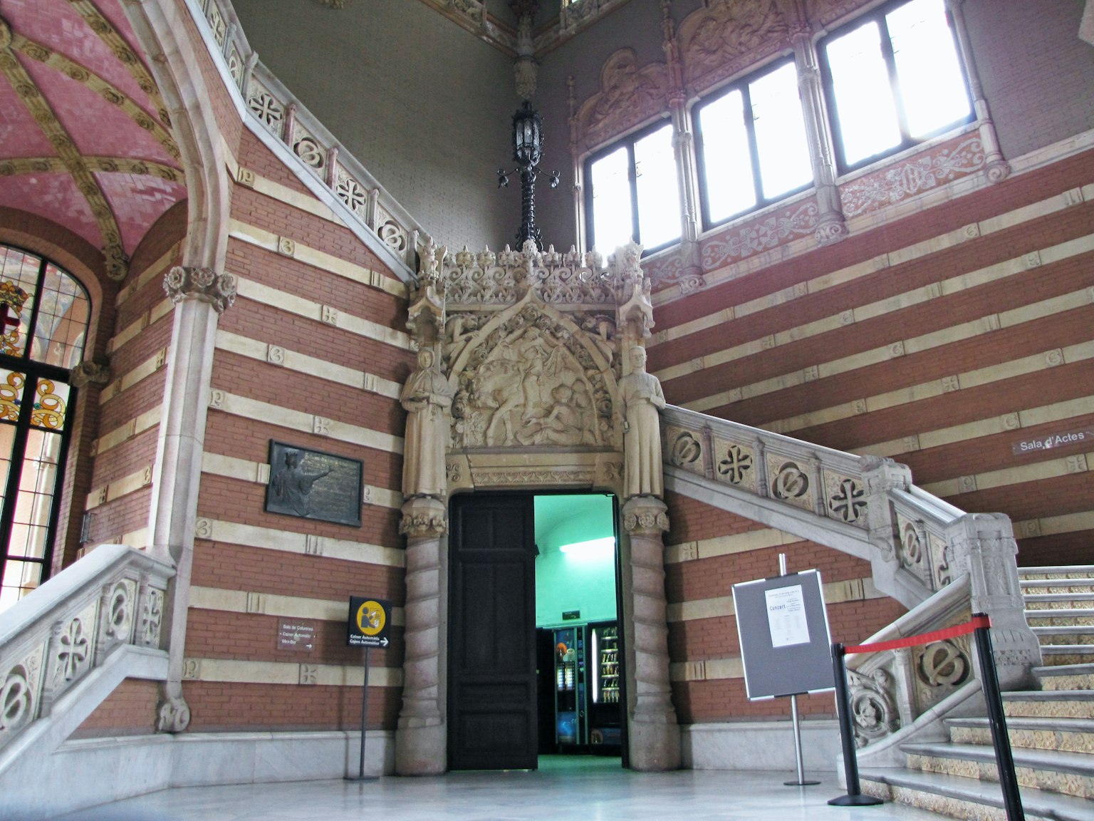 Interior of a building featuring ornate staircase and sculpted entrance