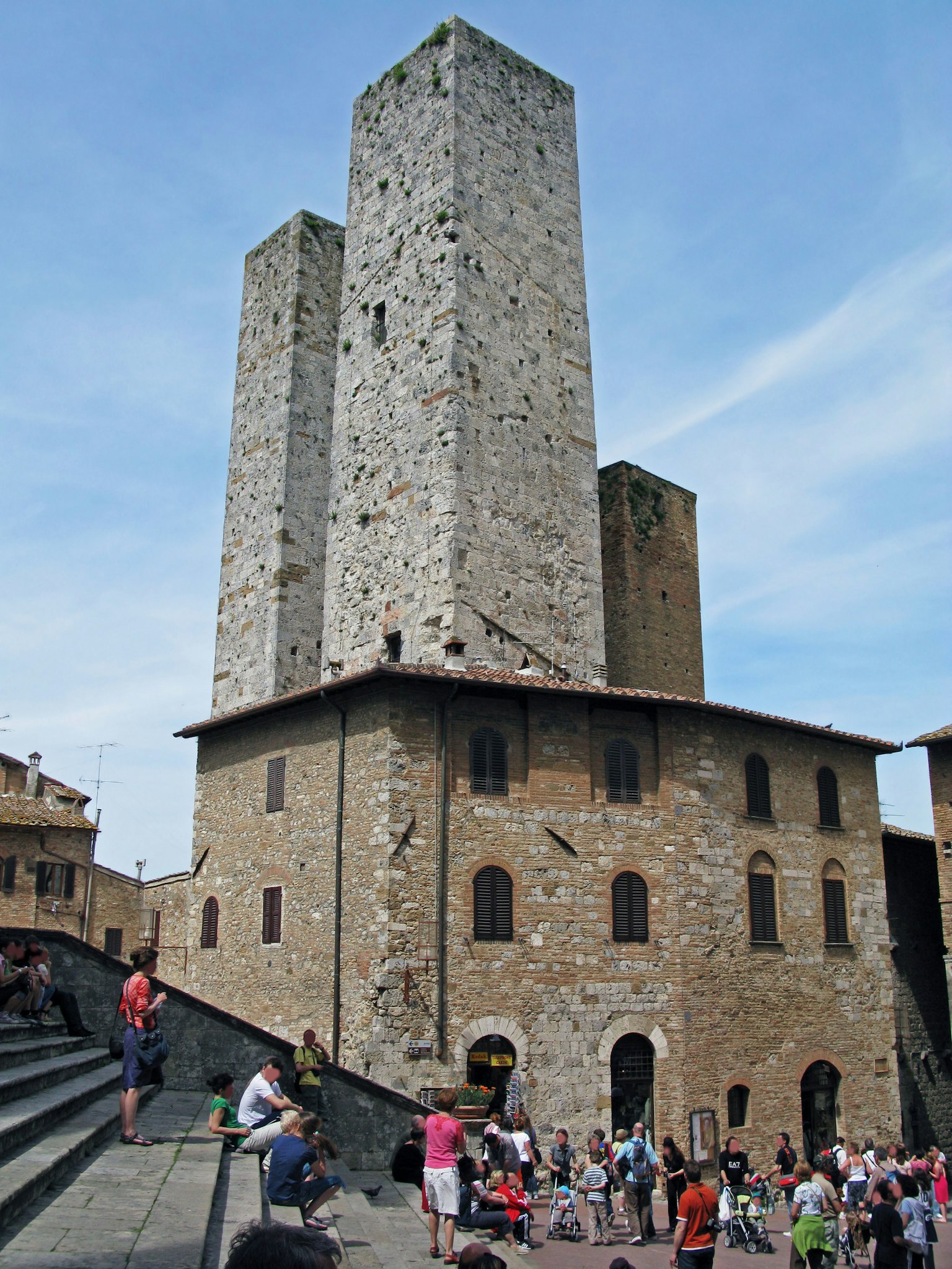 Medieval towers with tourists gathering in front