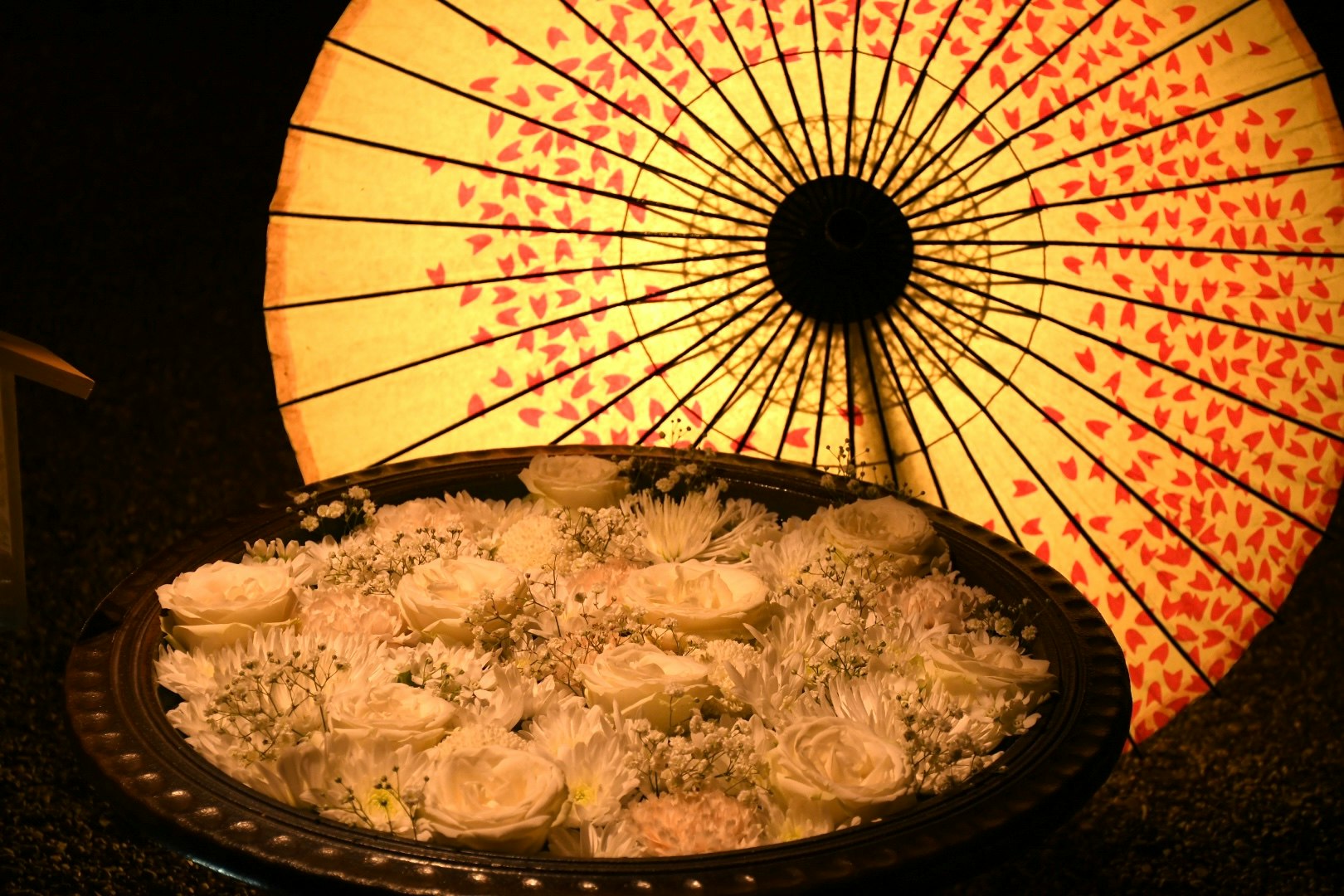 assorted Japanese sweets under a lantern-lit glow