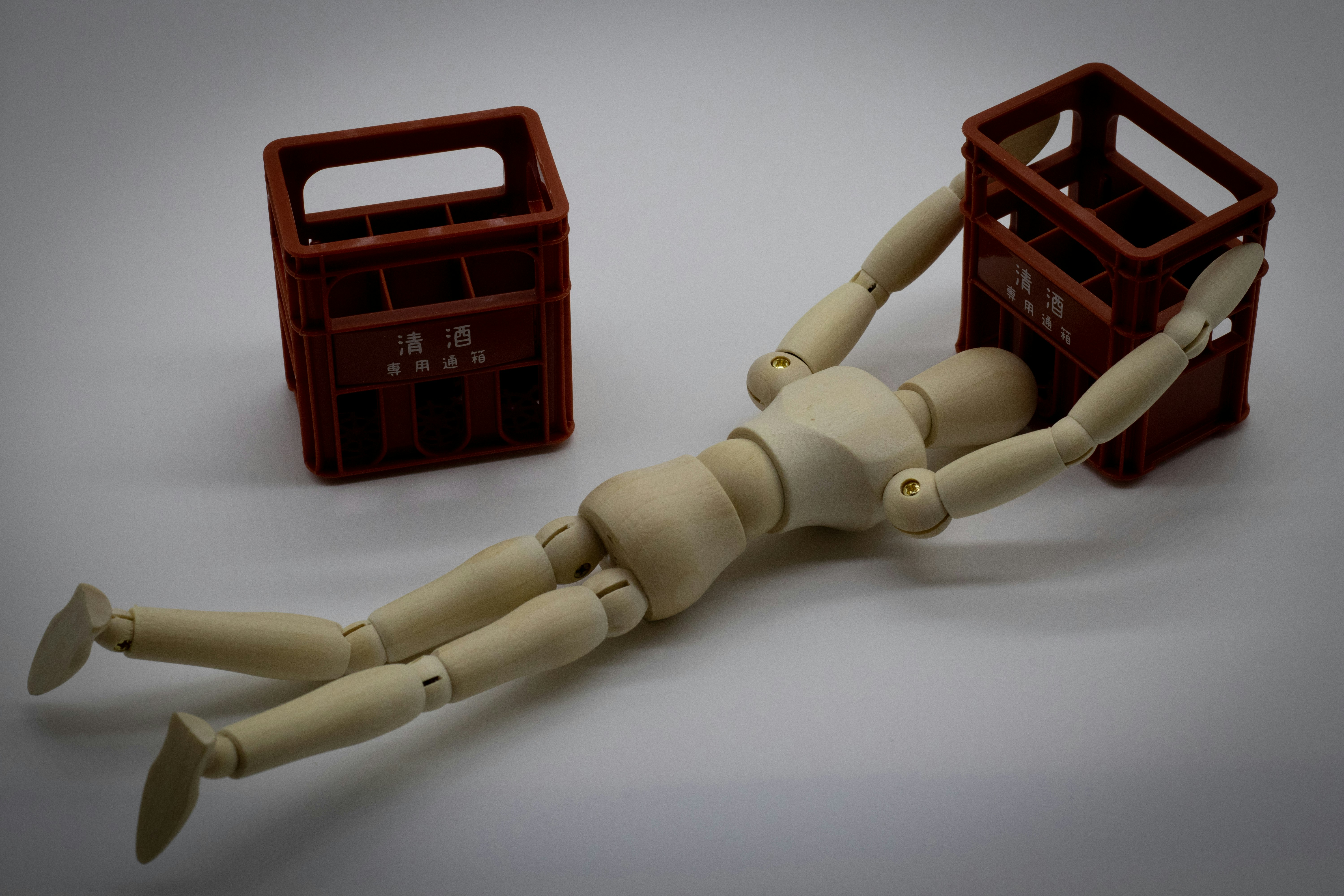articulated mannequin arm and toolbox still life