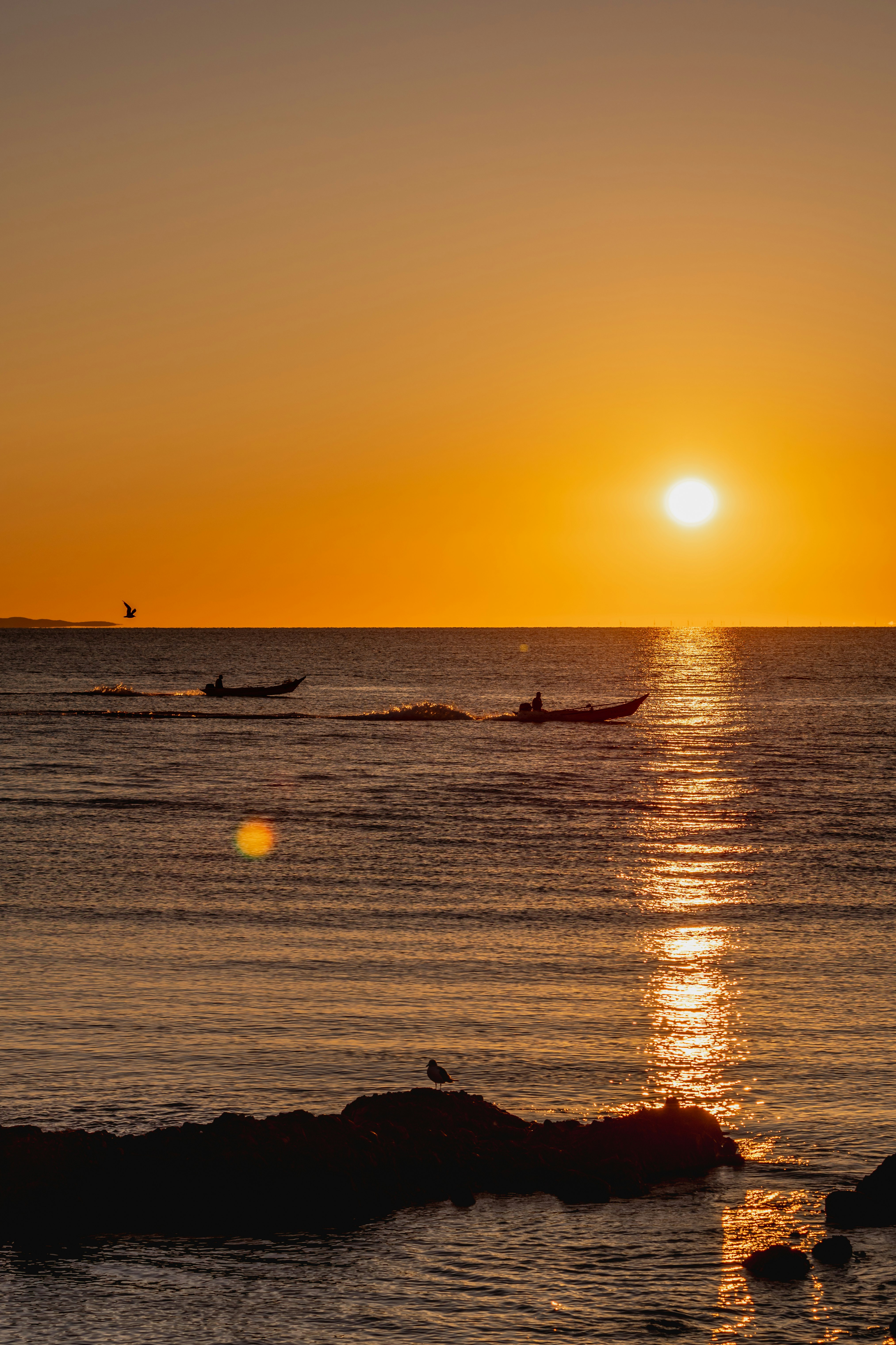 morning on Rebun Island’s seaside with fishing boats on the water at sunrise