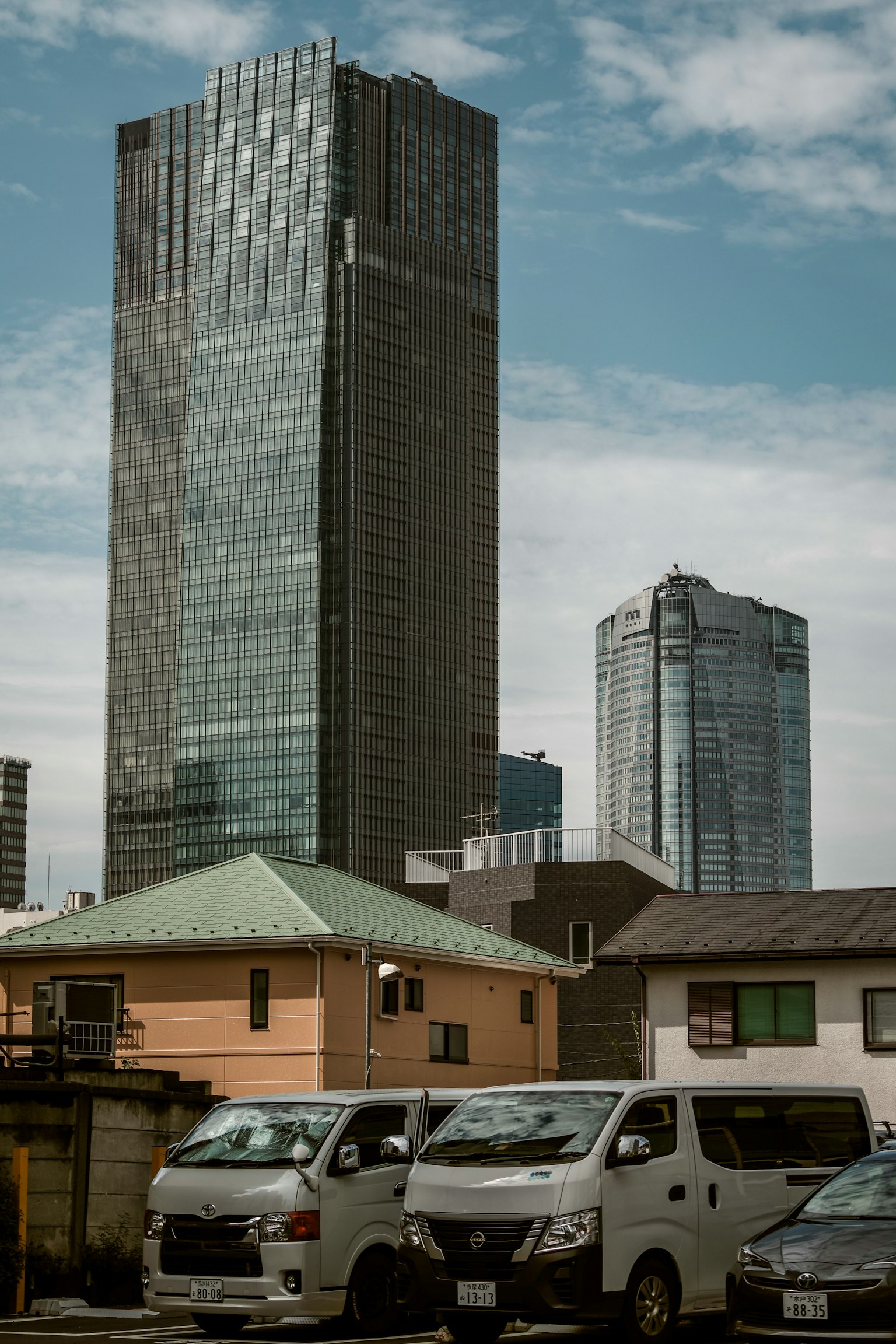 Urban landscape featuring skyscrapers and surrounding houses