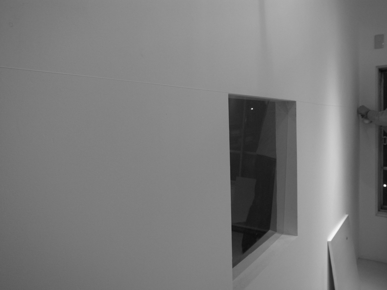 Modern interior with a white wall and a window