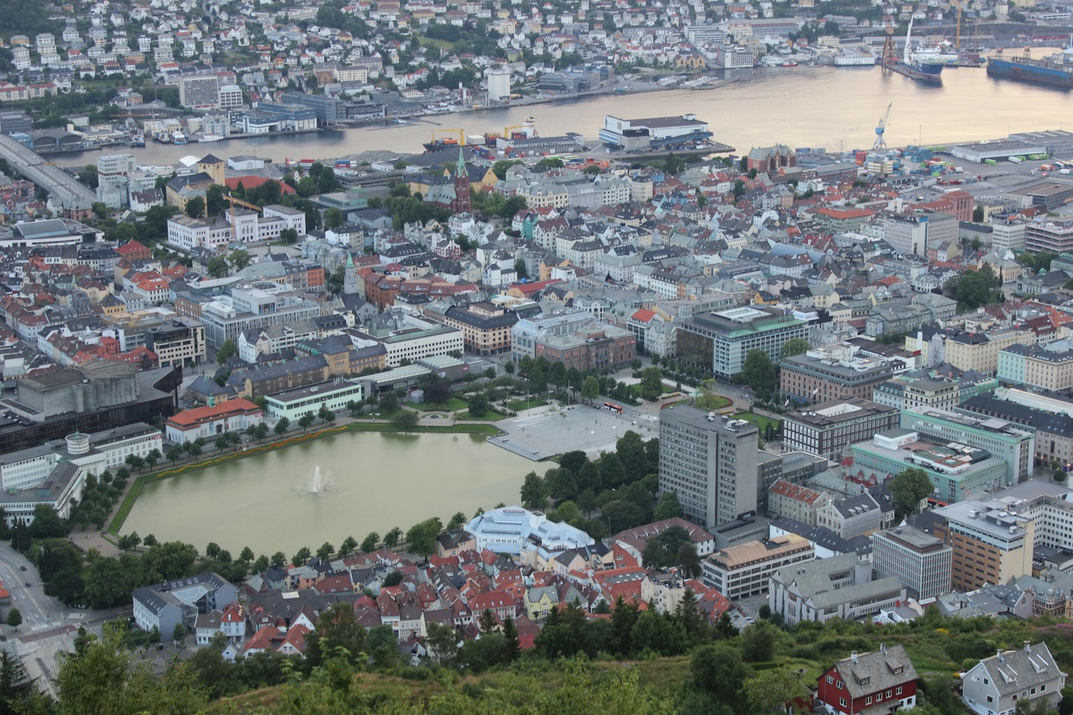 Aerial view of a city featuring a lake and buildings
