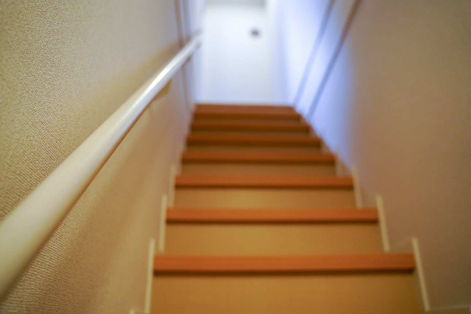 View of stairs from above bright light coming through