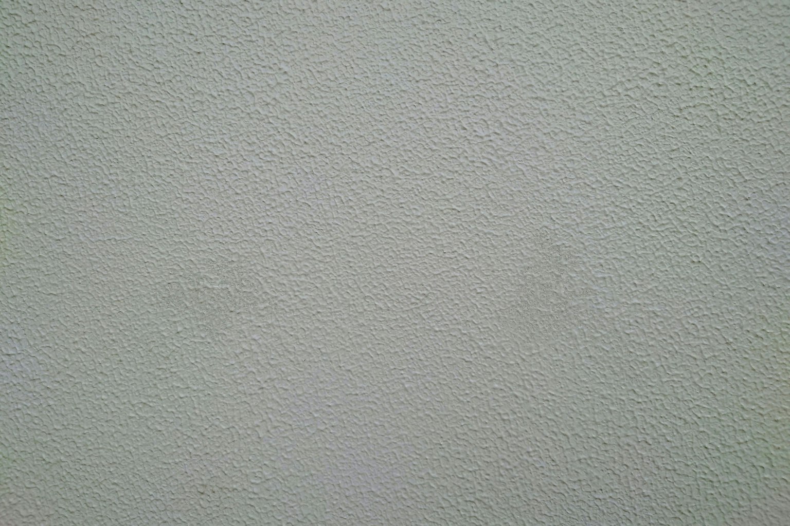 ผนังสีเทาอ่อนที่มีพื้นผิว