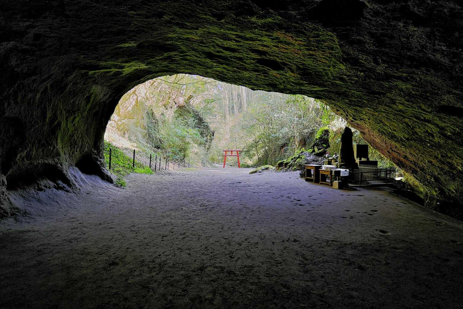 Wide cave interior with natural scenery and soft light