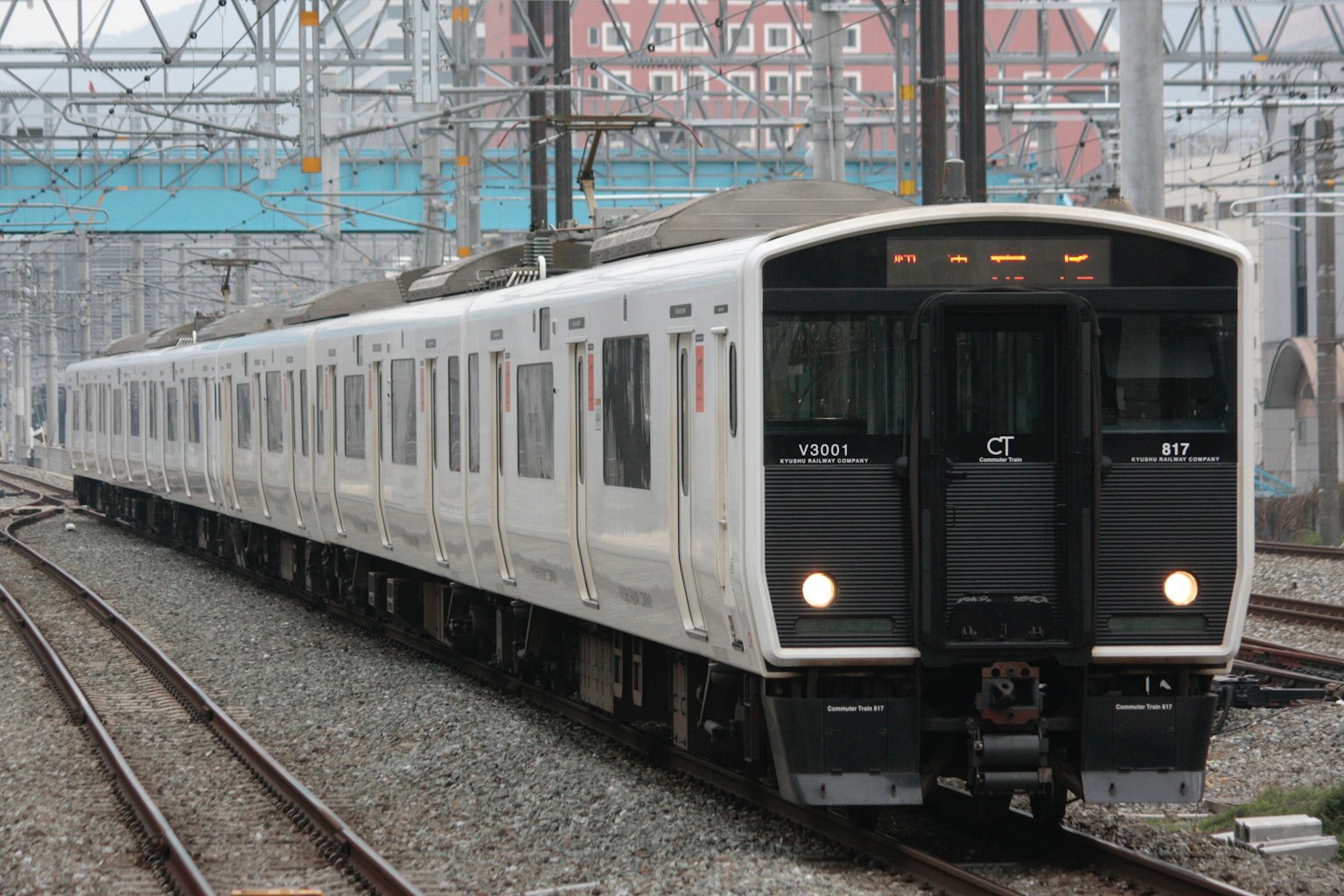 A white train stopped on the tracks