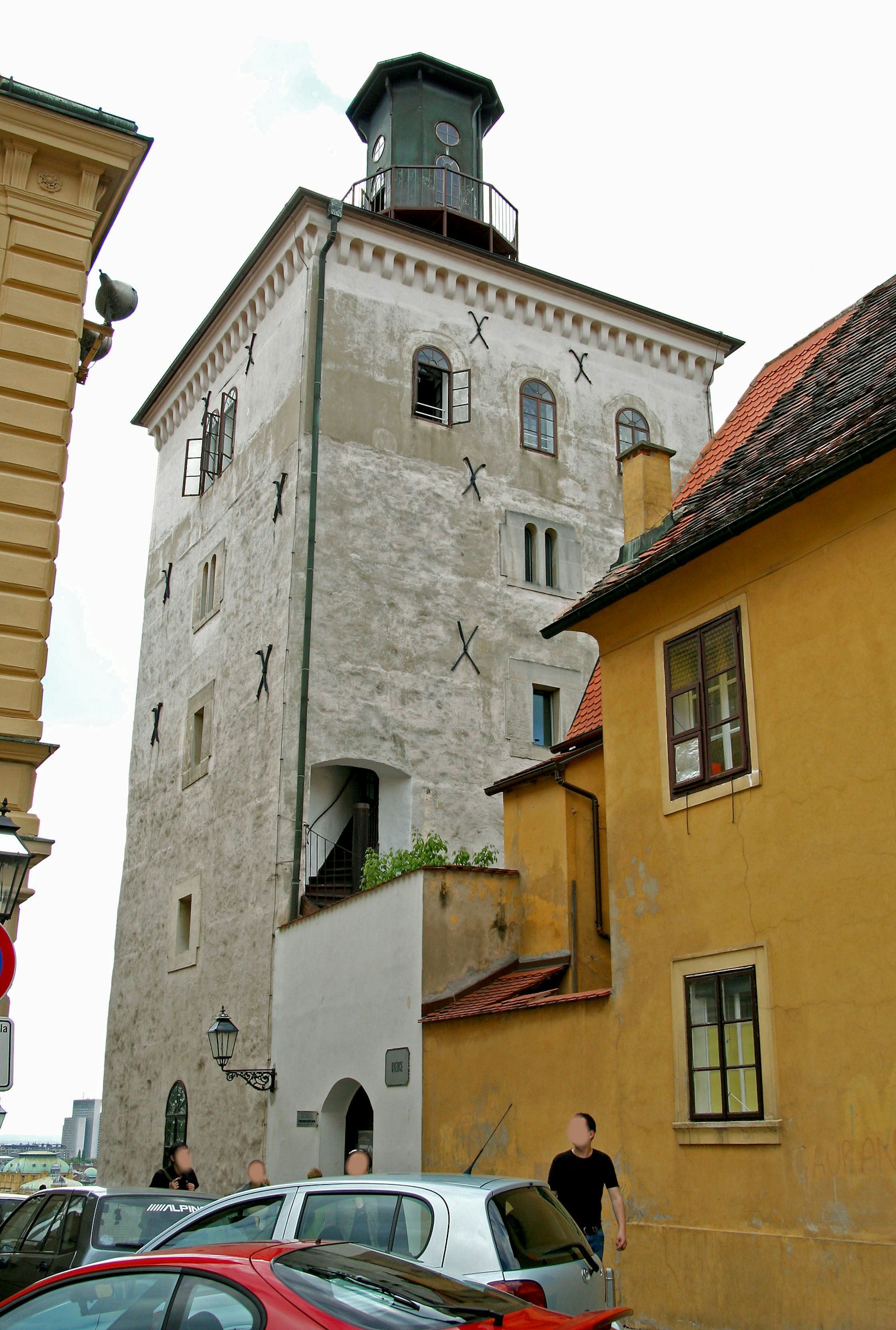 Historic tower with surrounding buildings