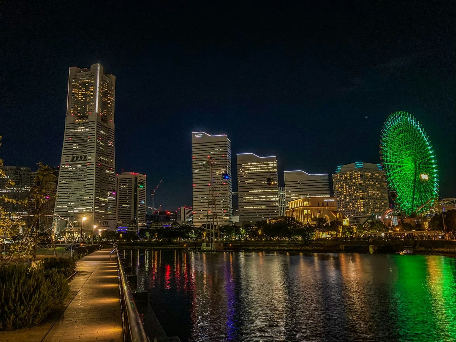 Night view of Yokohama skyline with green Ferris wheel