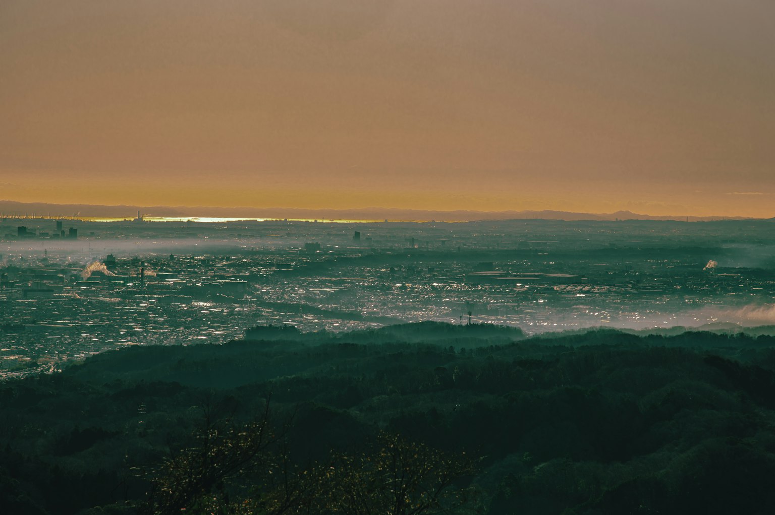 Sunset over the coastline with waves