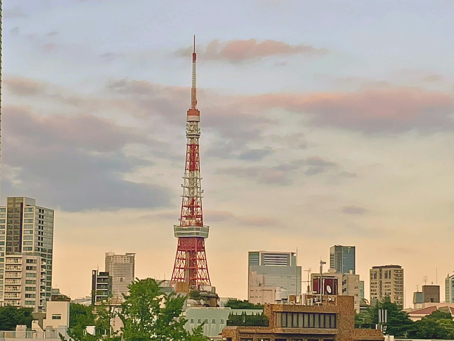Tokyo Tower standing against a sunset skyline
