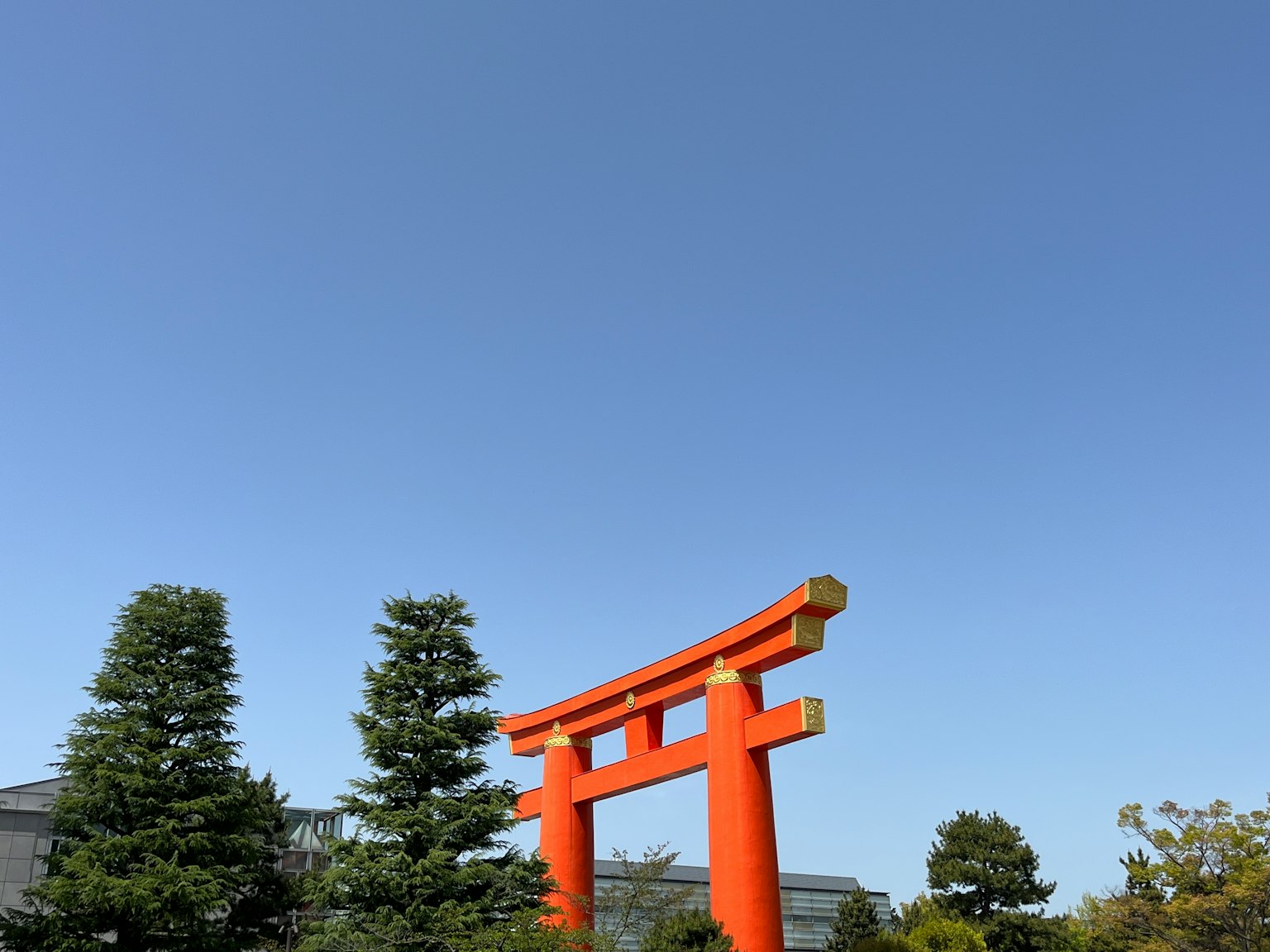 Red torii gate under a clear blue sky
