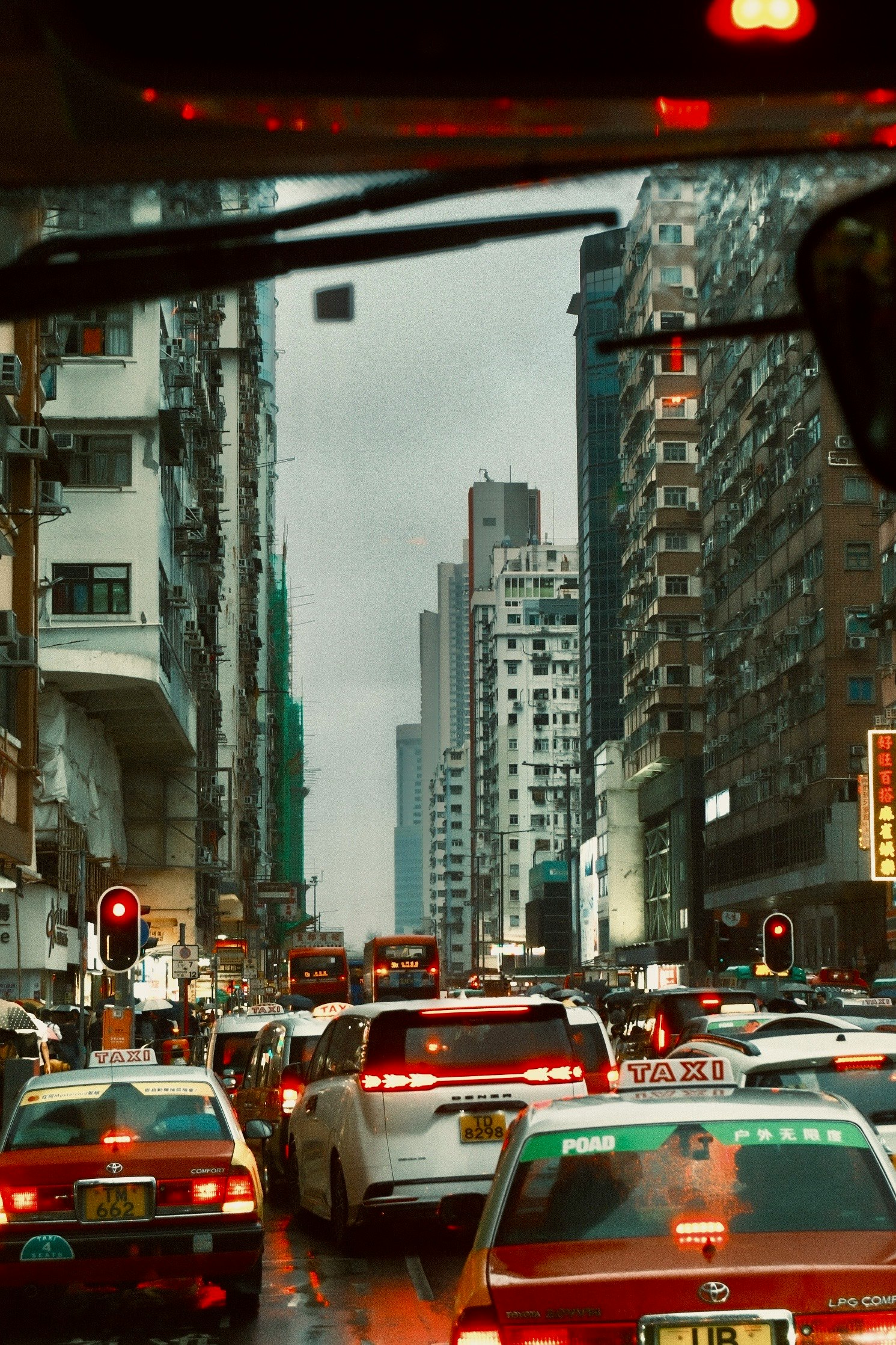 Traffic jam at an urban intersection with tall buildings