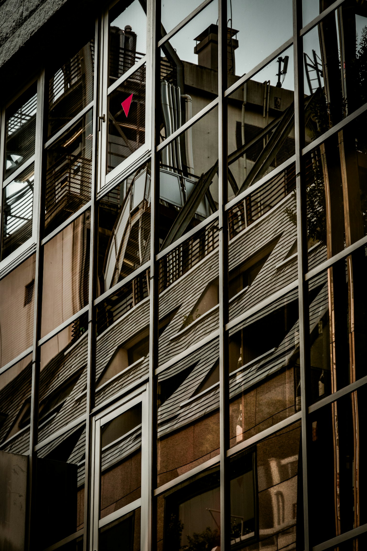 Reflection of urban architecture in building windows