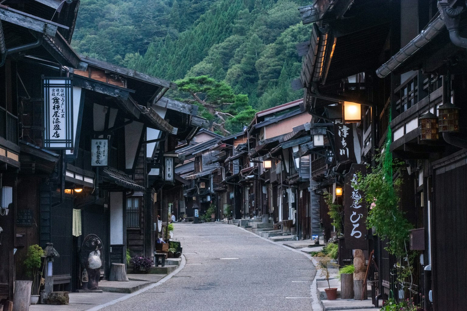 Quiet old town street with traditional wooden buildings and cobblestone path