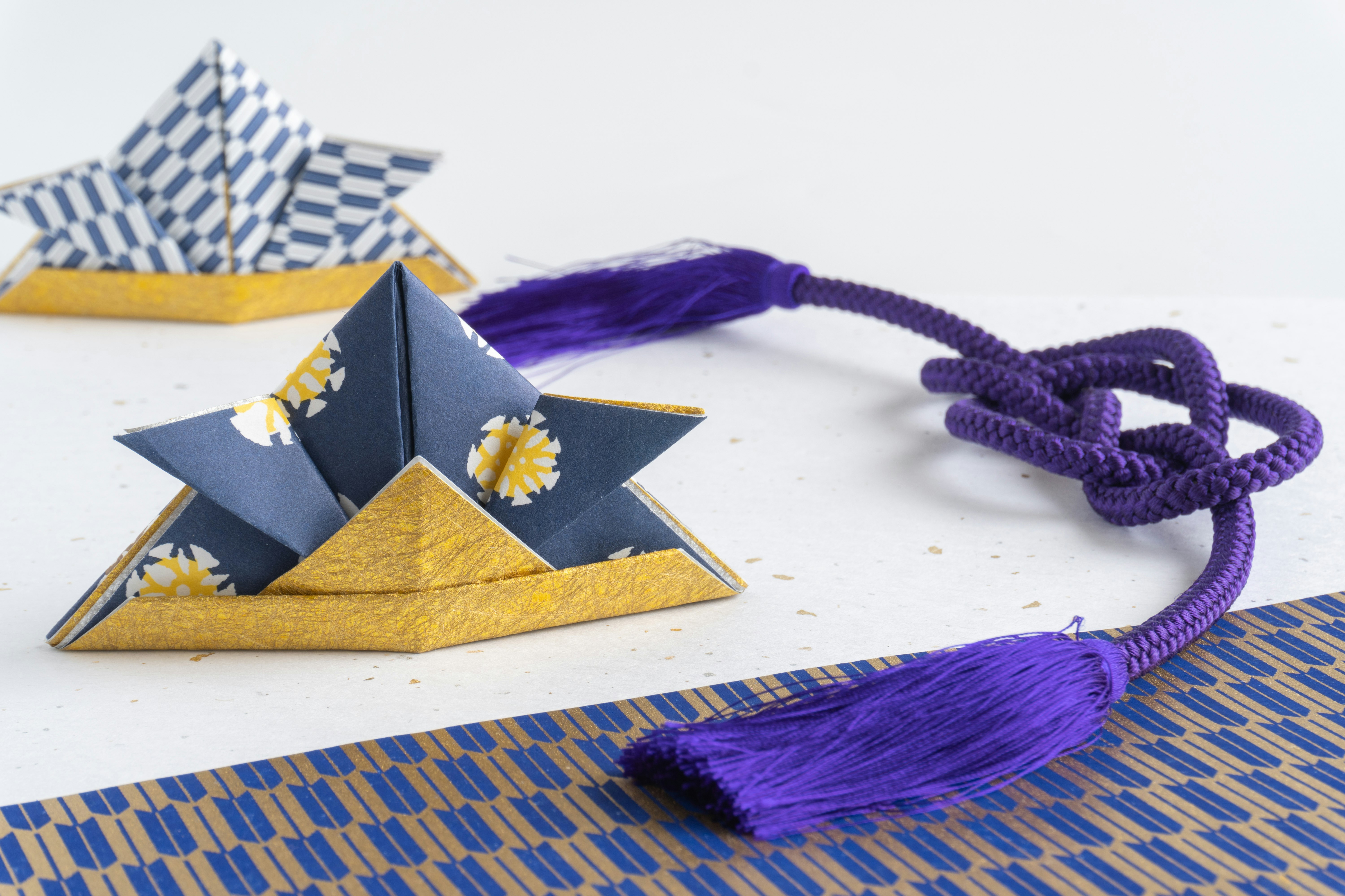 purple tassel origami star decoration with small envelopes