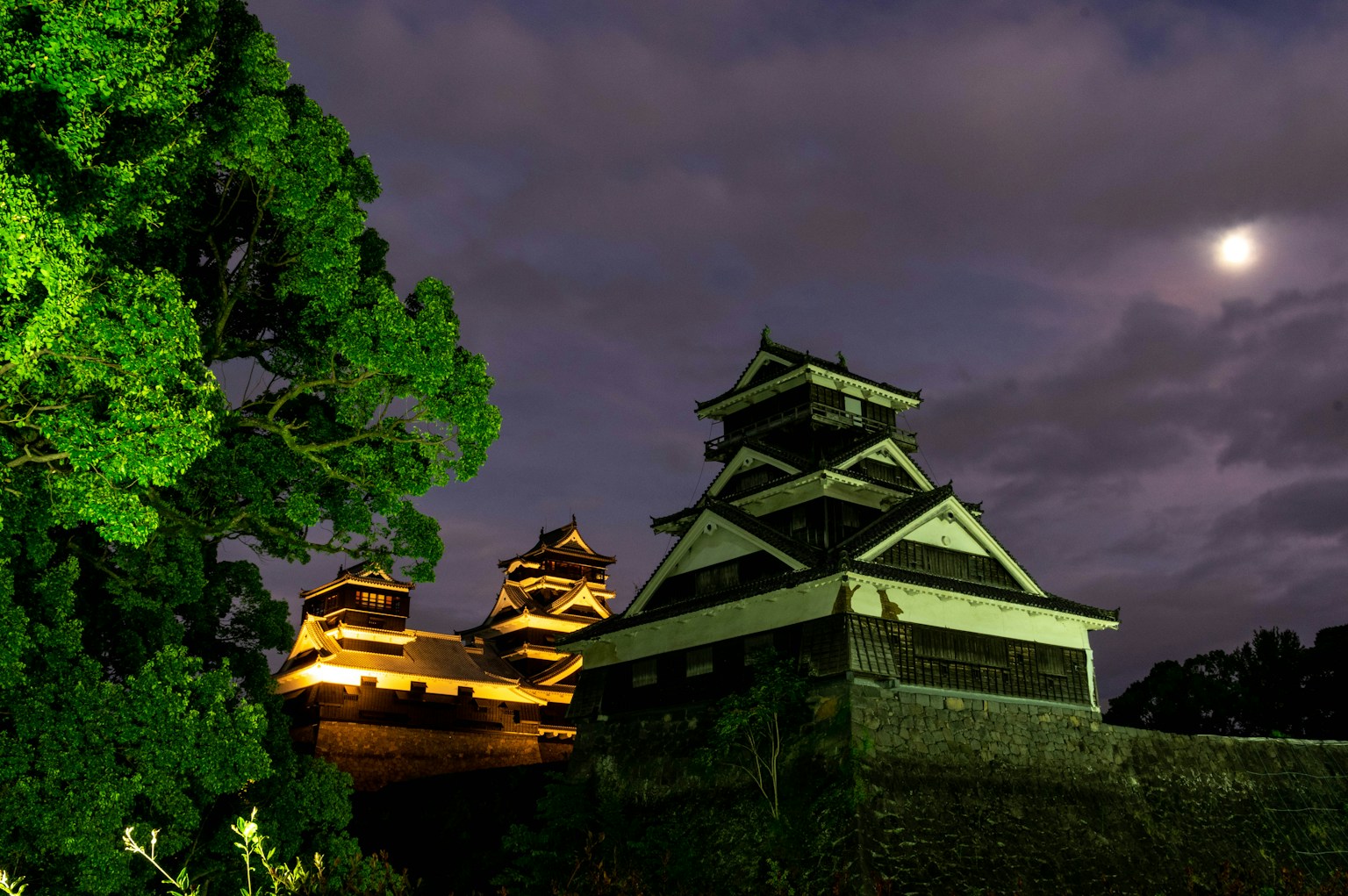 Night view of Kumamoto Castle illuminated by moonlight