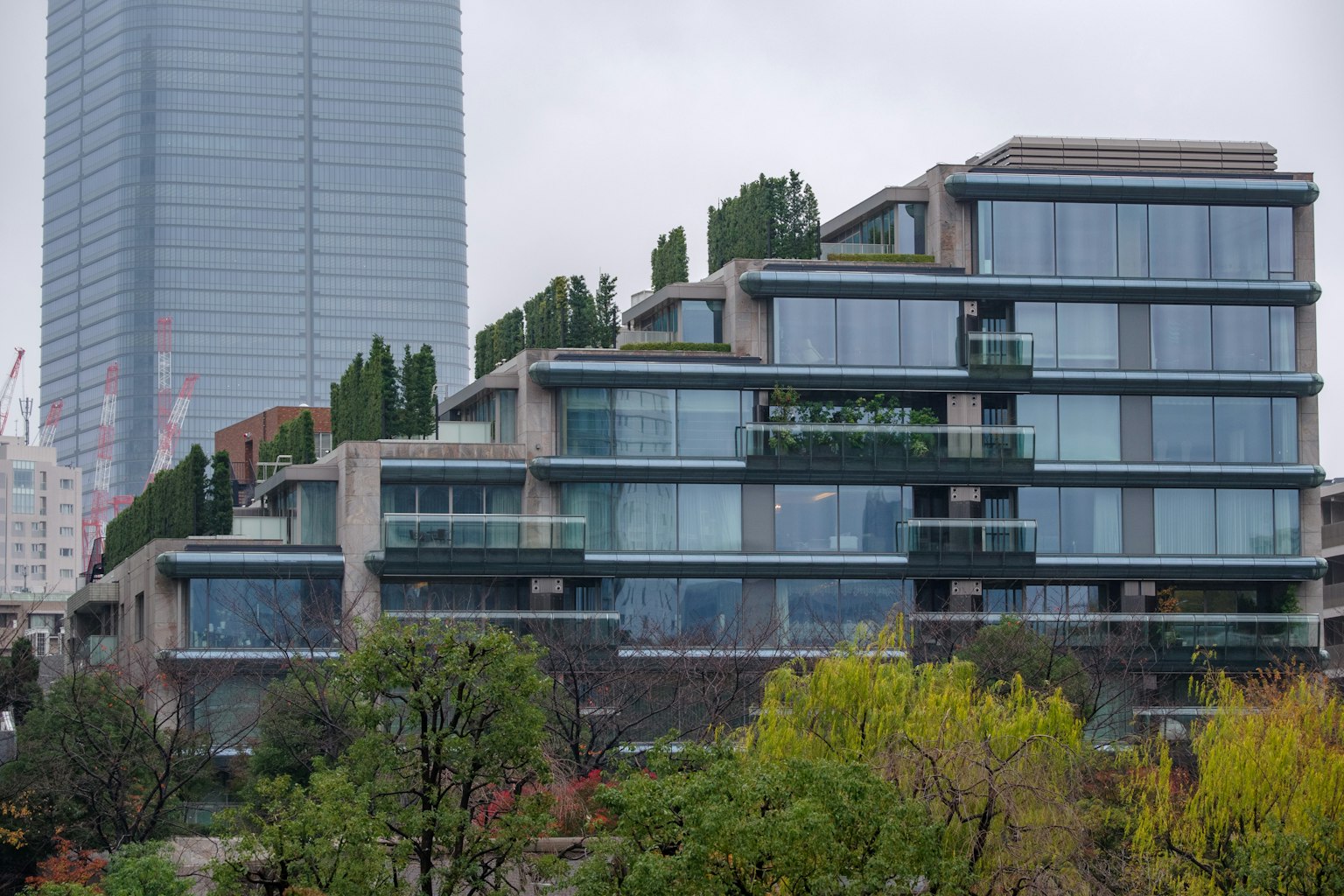 Modern residential building with green rooftop gardens