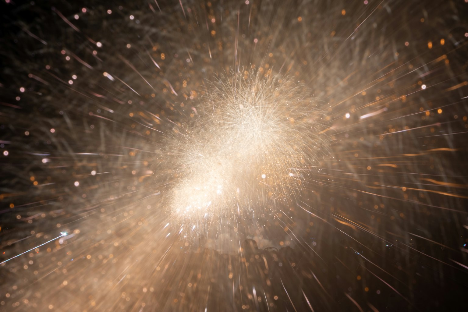 Un fond captivant avec des particules radieuses se répandant vers l'extérieur