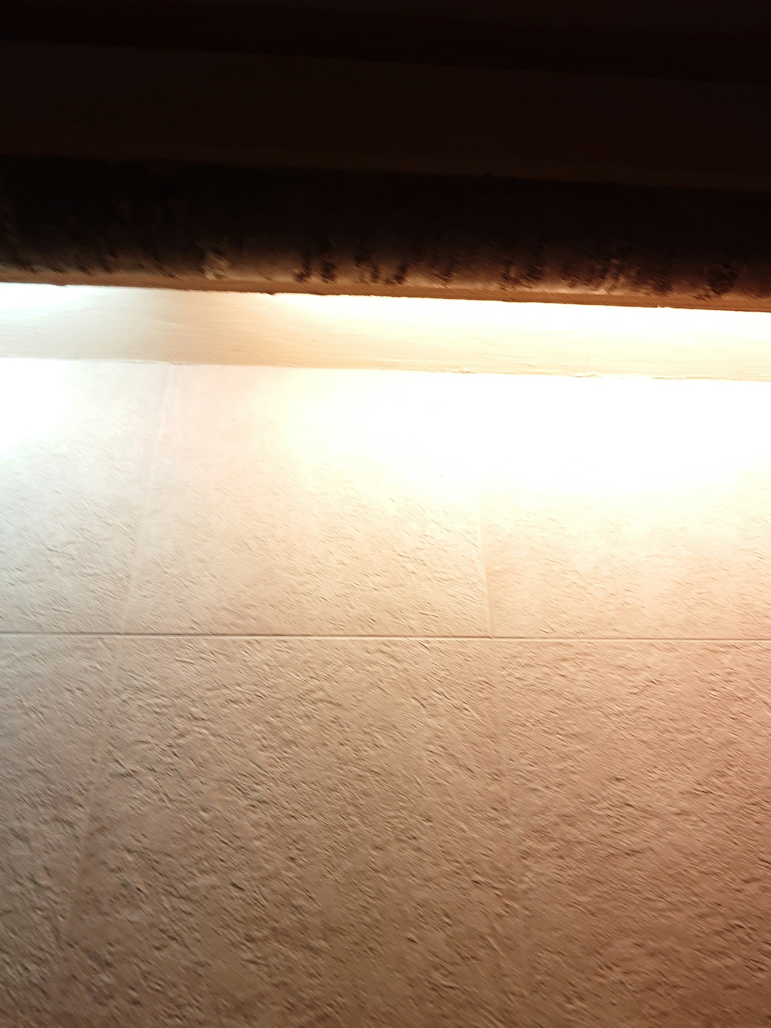 Simple image of lighting on a textured wall