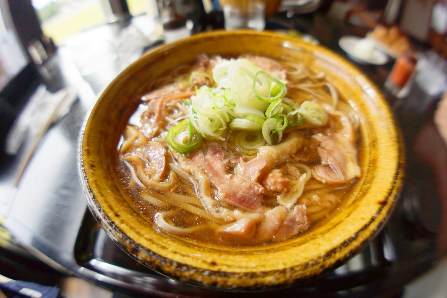 A delicious bowl of ramen topped with green onions