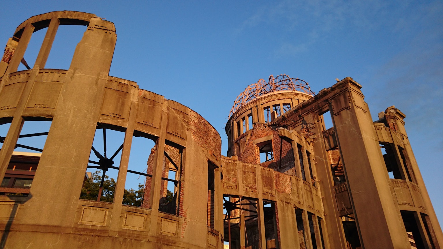 Exterior view of the Hiroshima Peace Memorial with blue sky