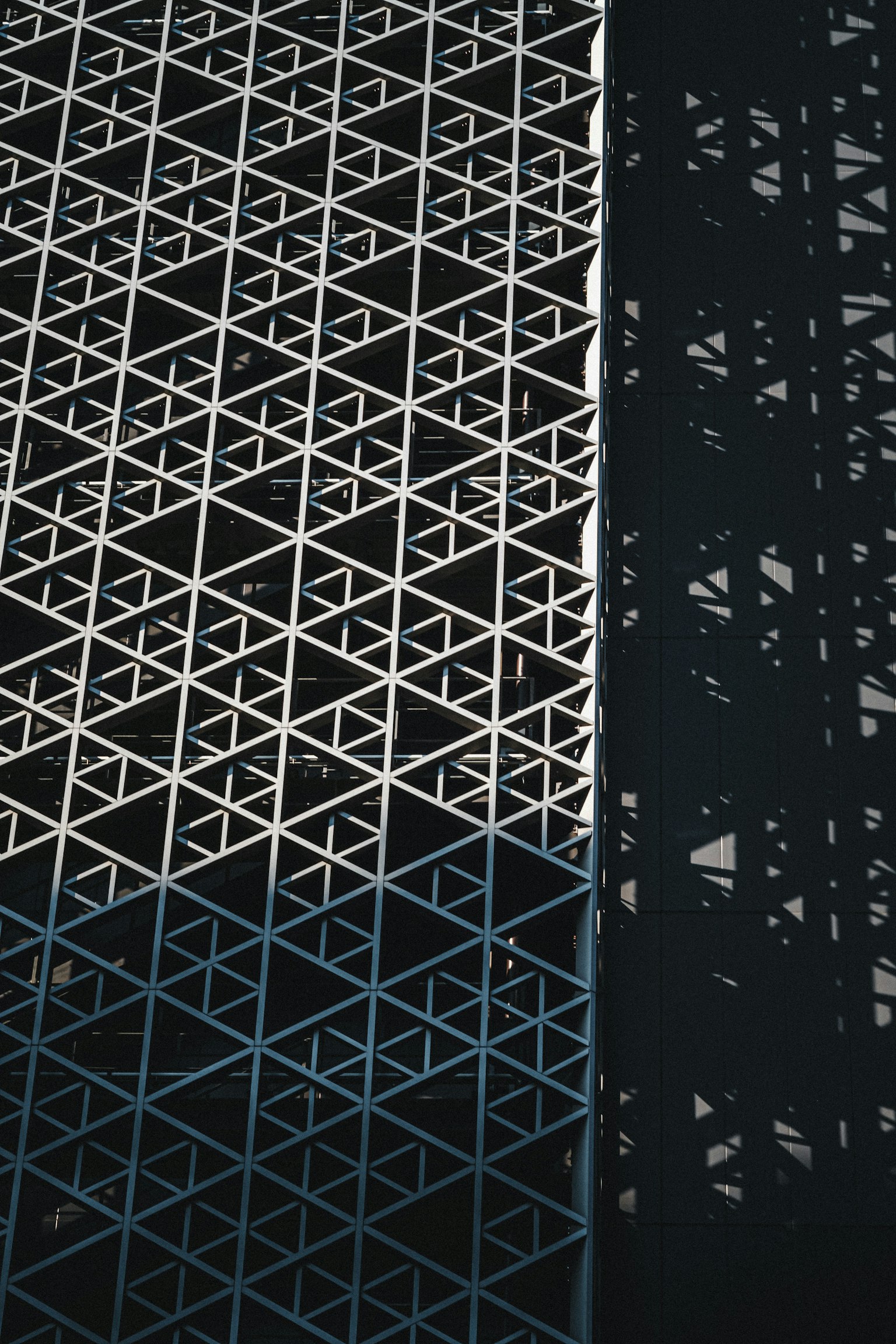 Geometric pattern of intersecting black and white wall surfaces