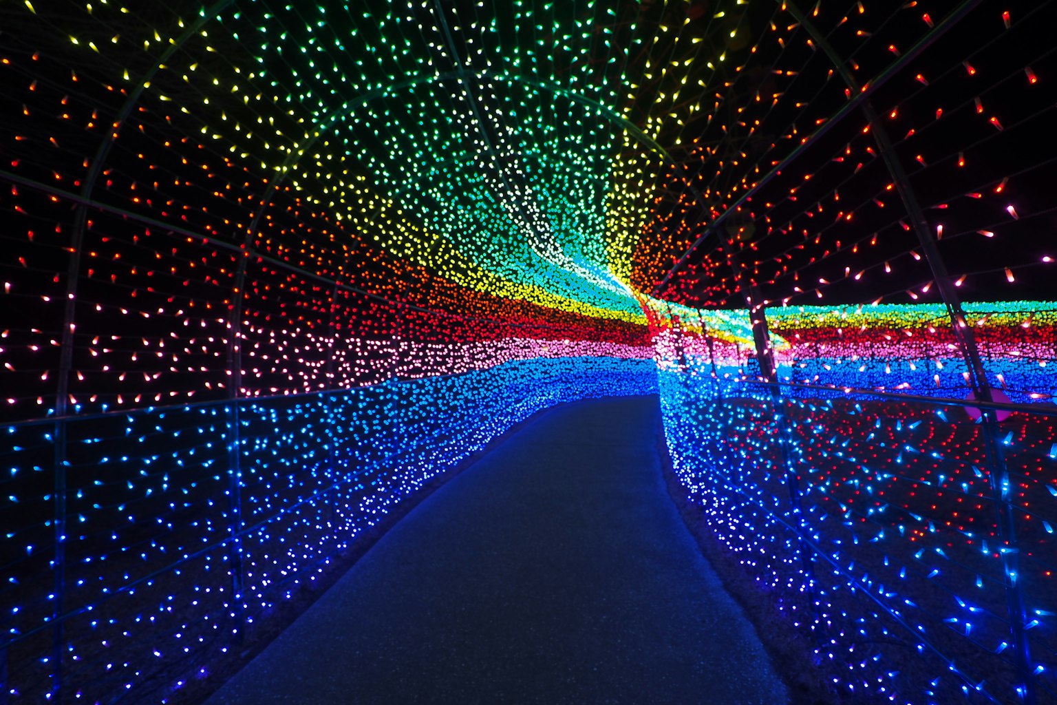 Colorful illuminated tunnel with vibrant lights creating a mesmerizing effect