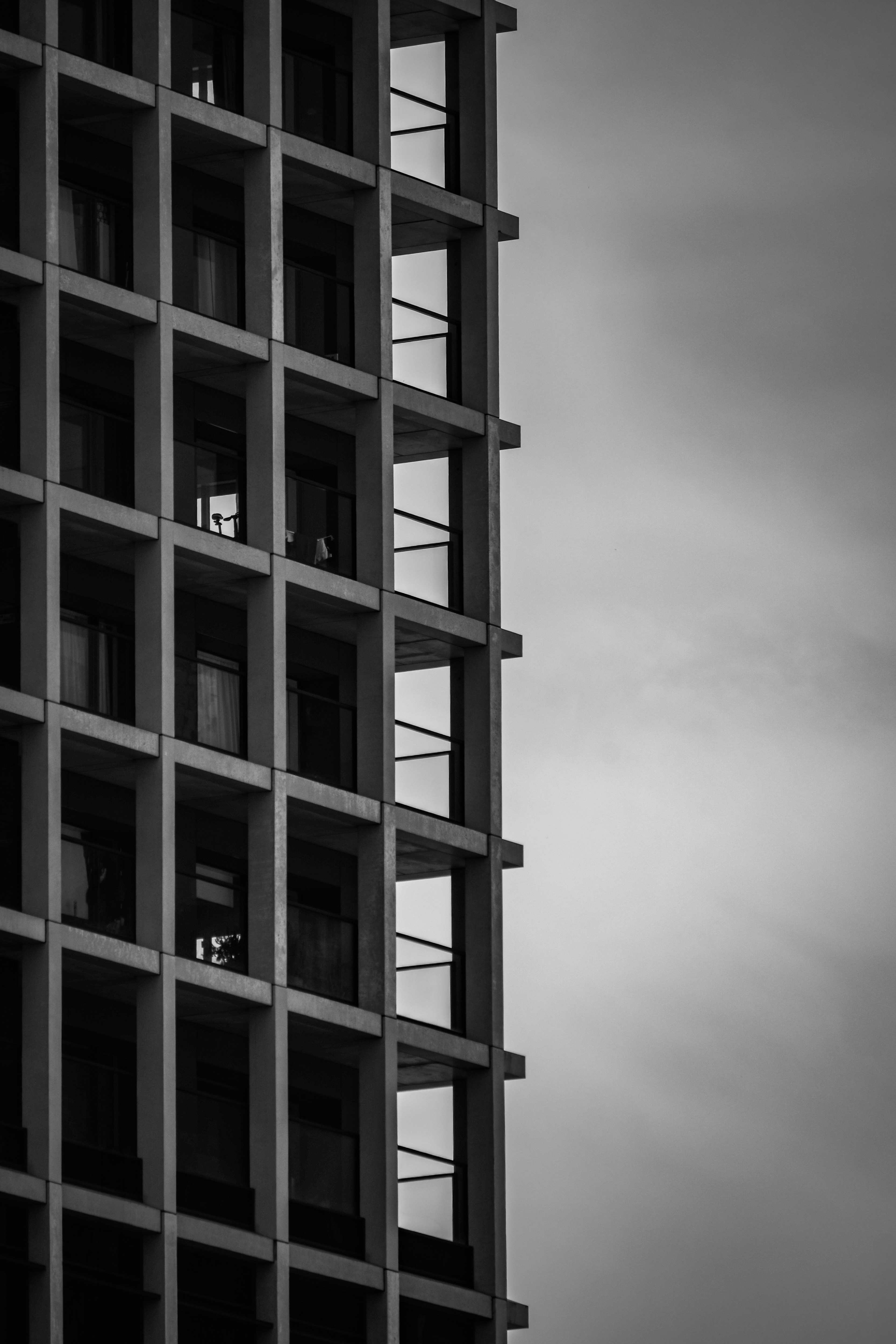 exterior of a high-rise apartment building with a terrace