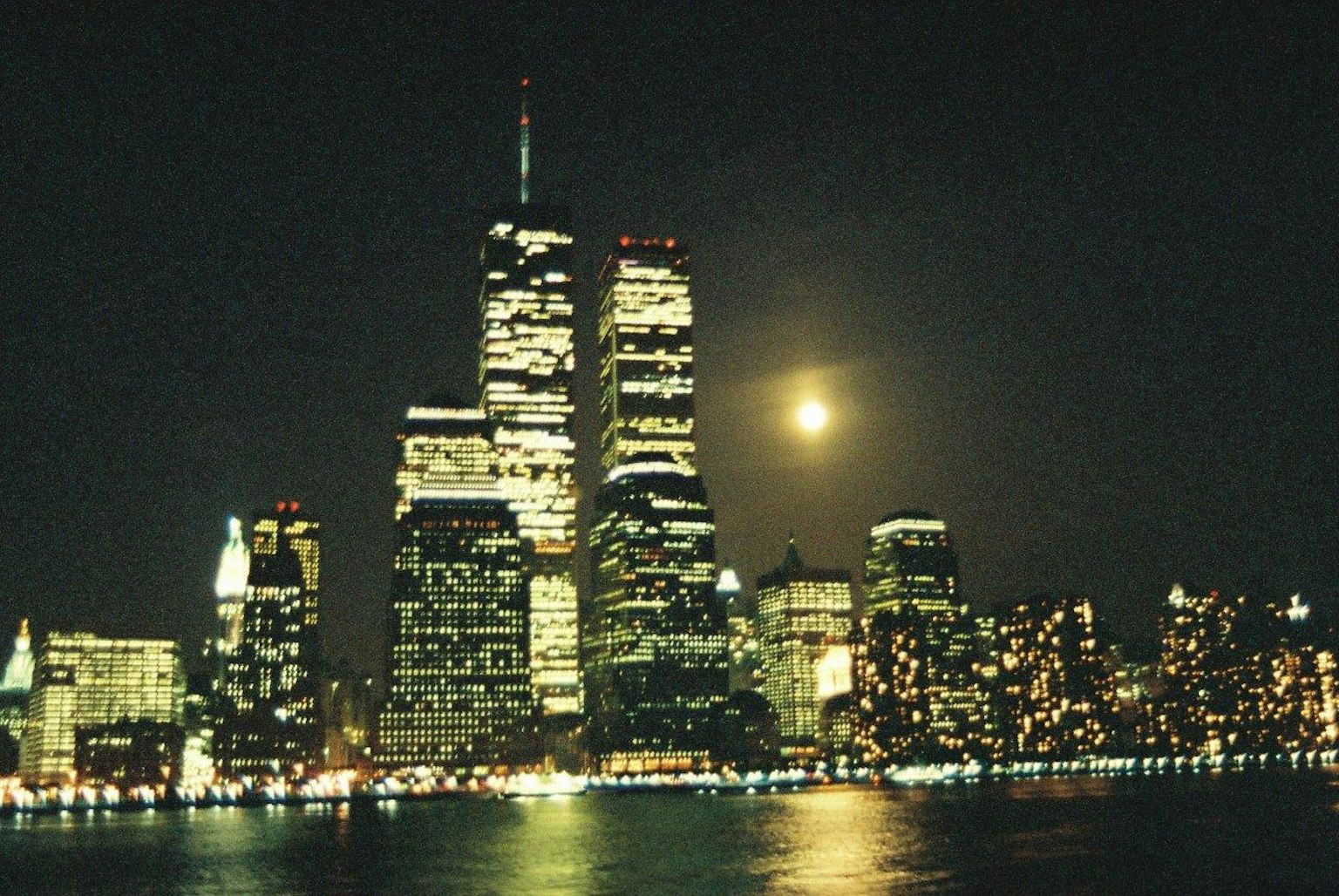 New York City skyline at night illuminated by moonlight