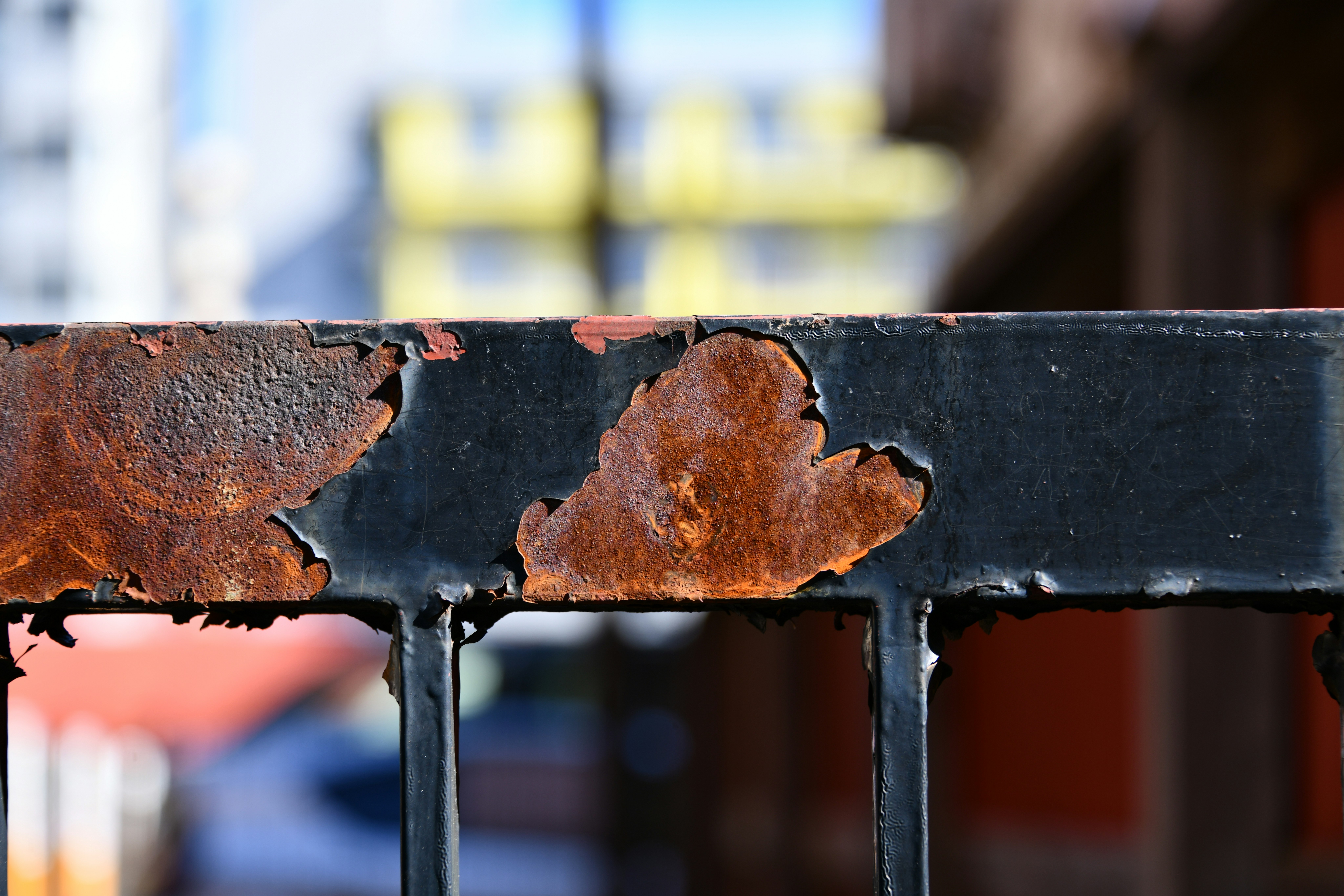 rusted metal fence with peeling paint